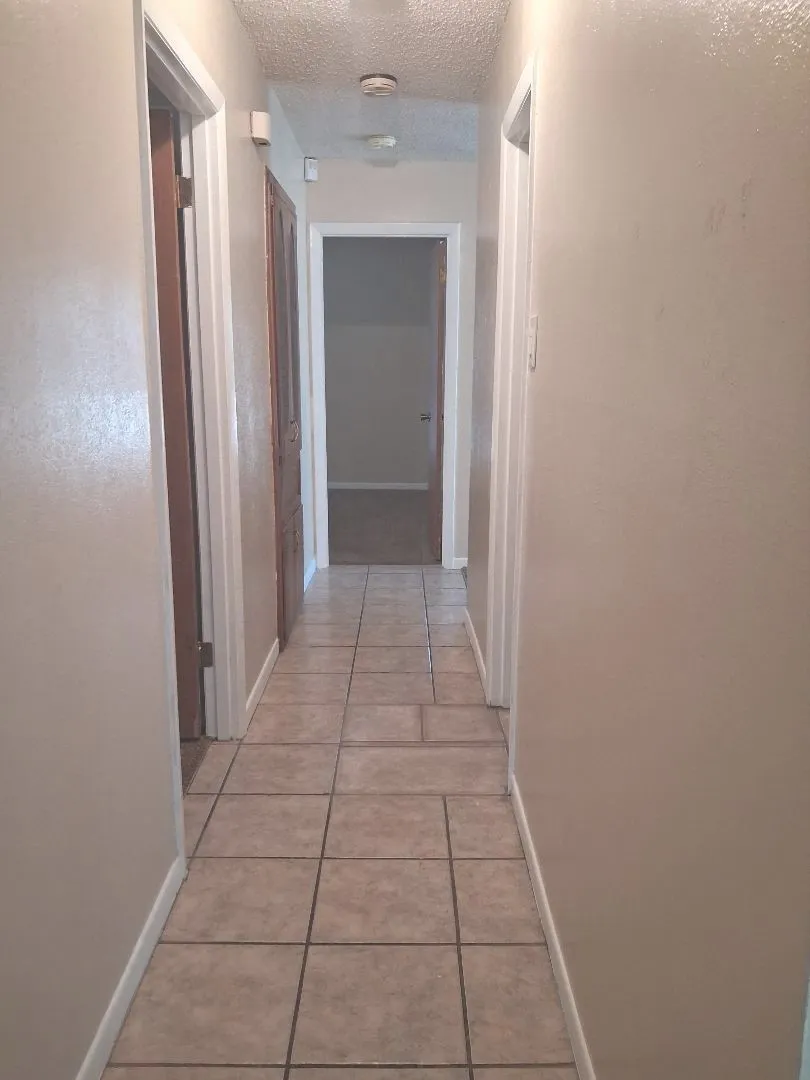 TILED HALLWAY BETWEEN ALL BEDROOMS