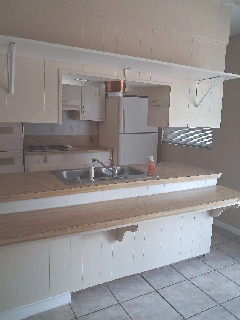 KITCHEN BAR AND FRIDGE REMAINS