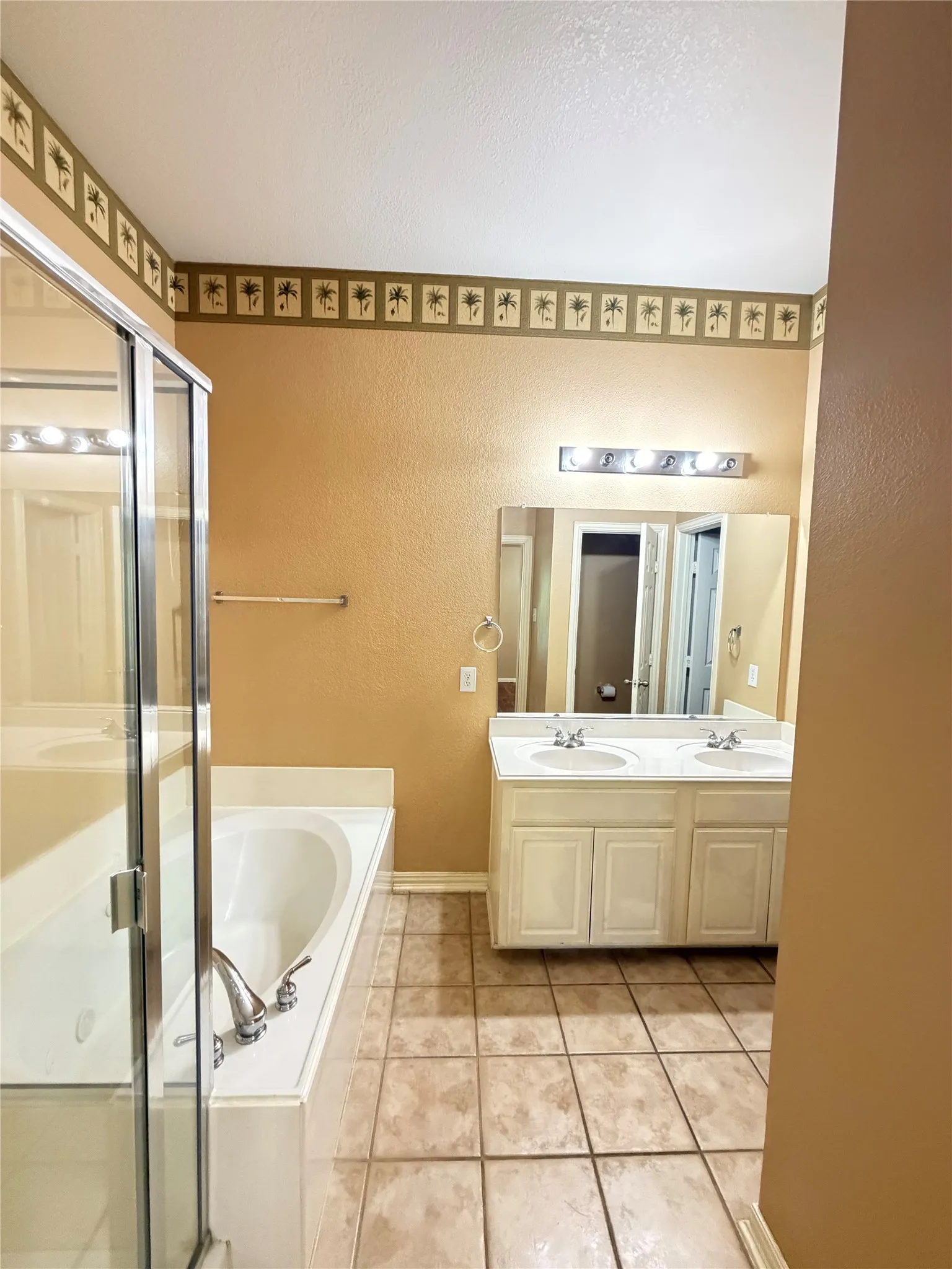 Dual vanity with undermount sinks, separate shower, and soaking tub