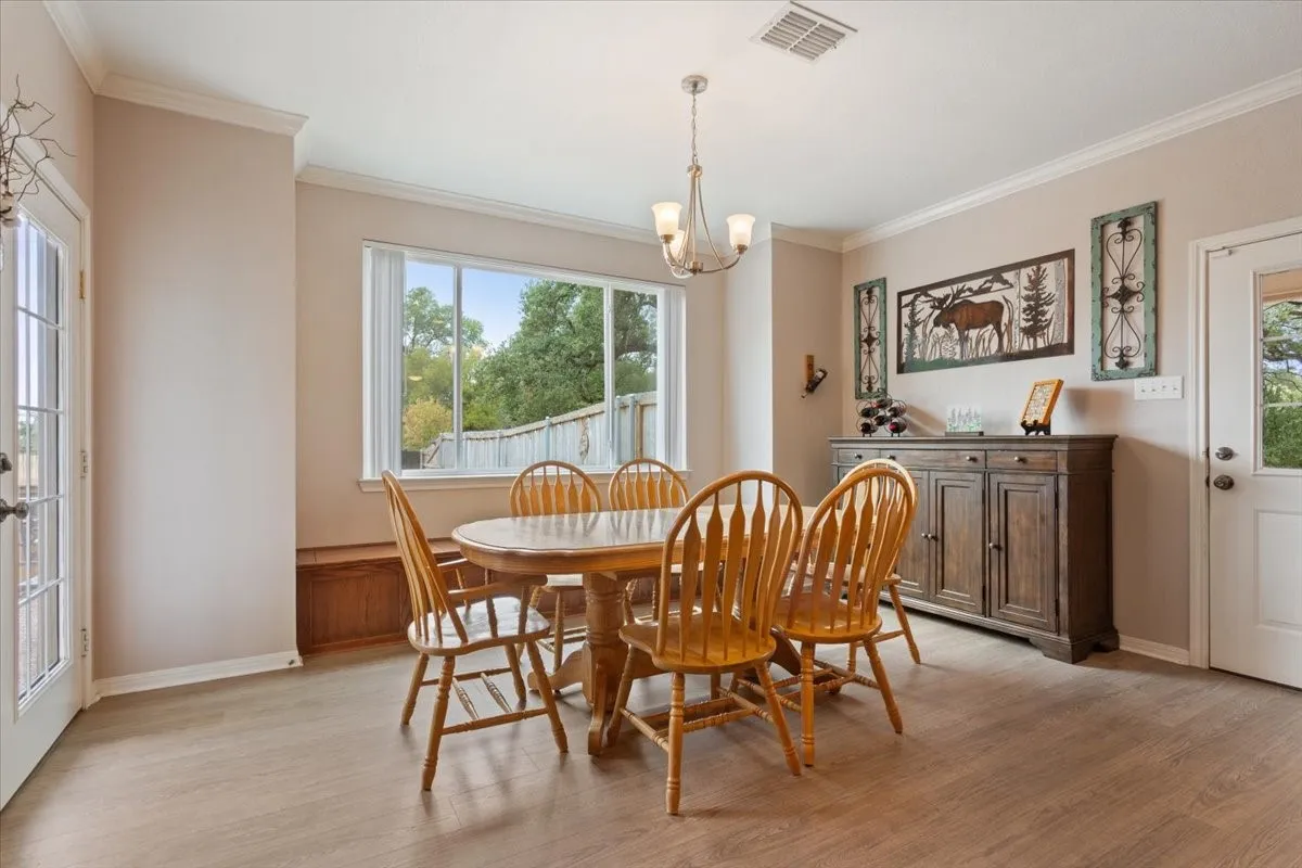 Wood-finish flooring throughout, with a built-in wood window bench