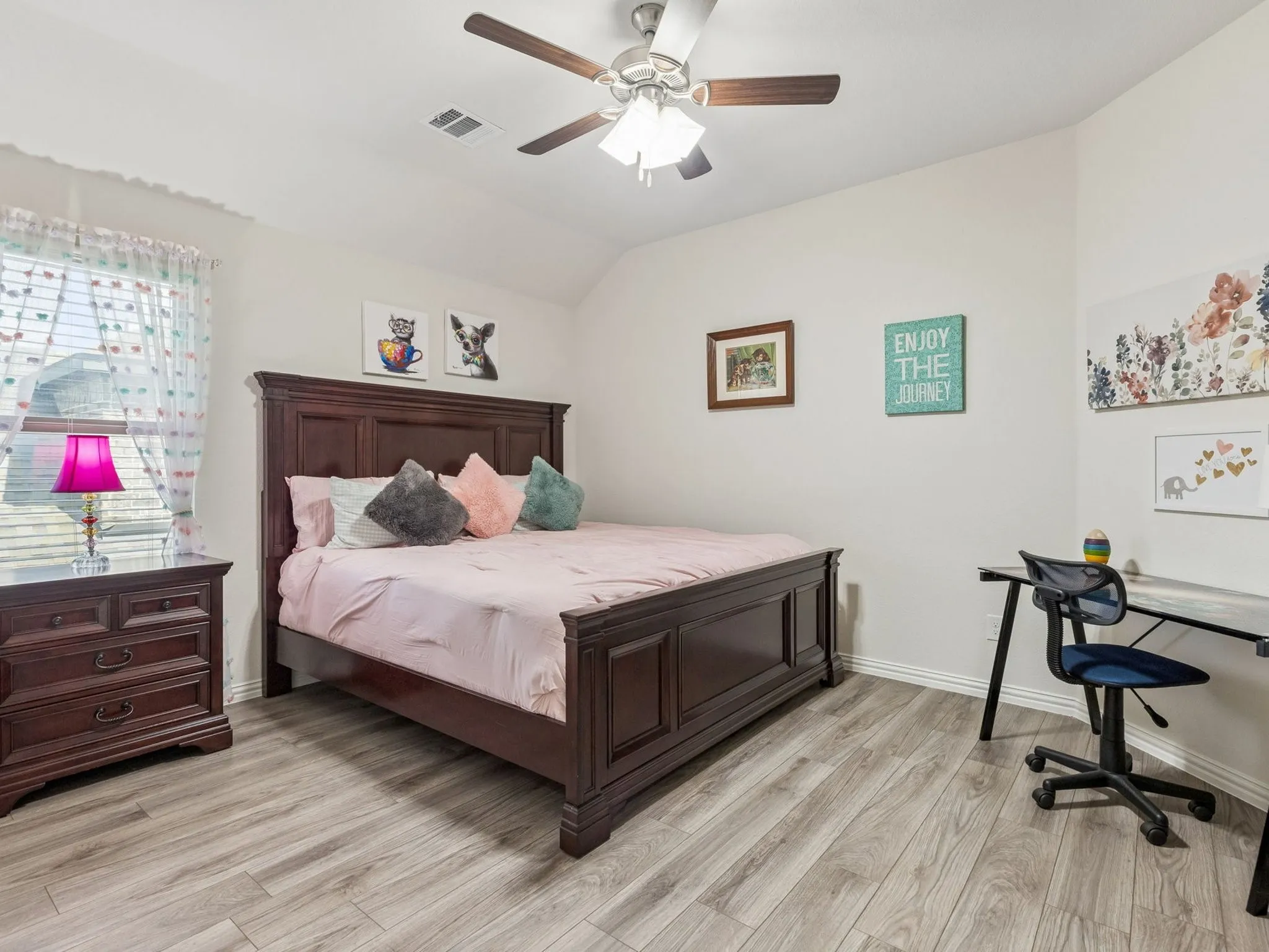 Window with blinds, wood-finish LVP flooring, ceiling fan with light fixture, and light wall paint