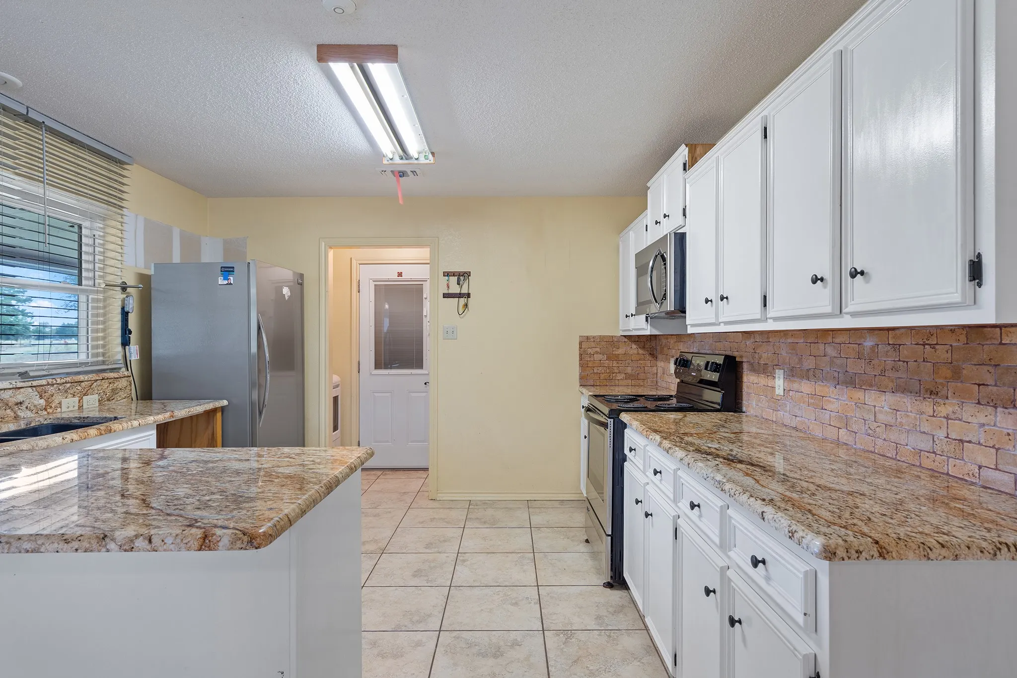 Eat in kitchen bar for visits or kids doing homework nearby while dinner gets cooked.