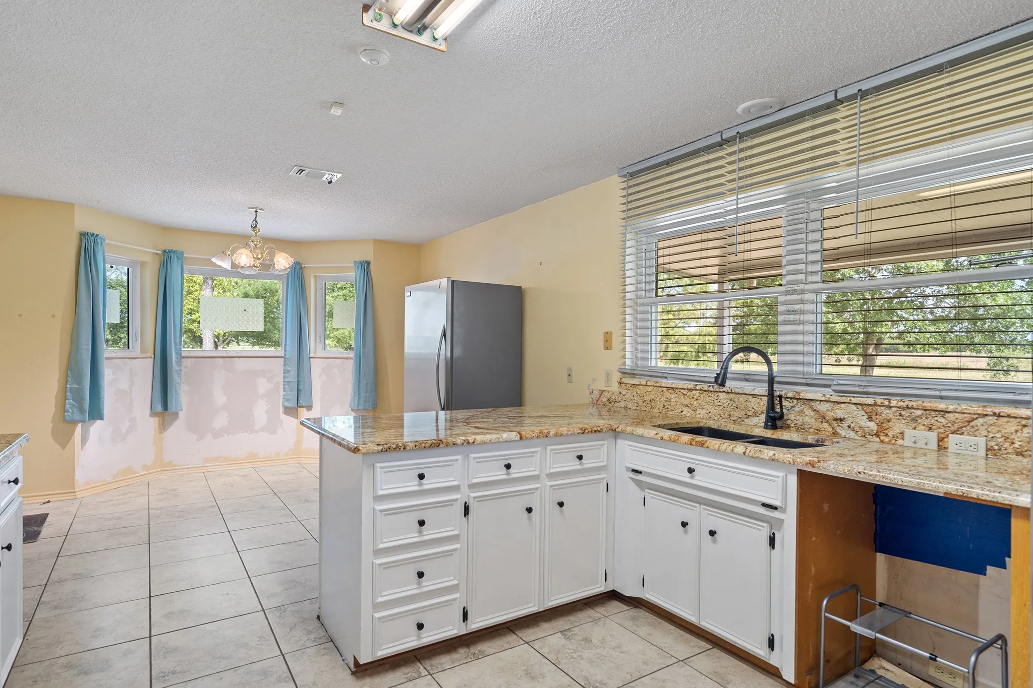 Trees and relaxing views enter throughout the home.