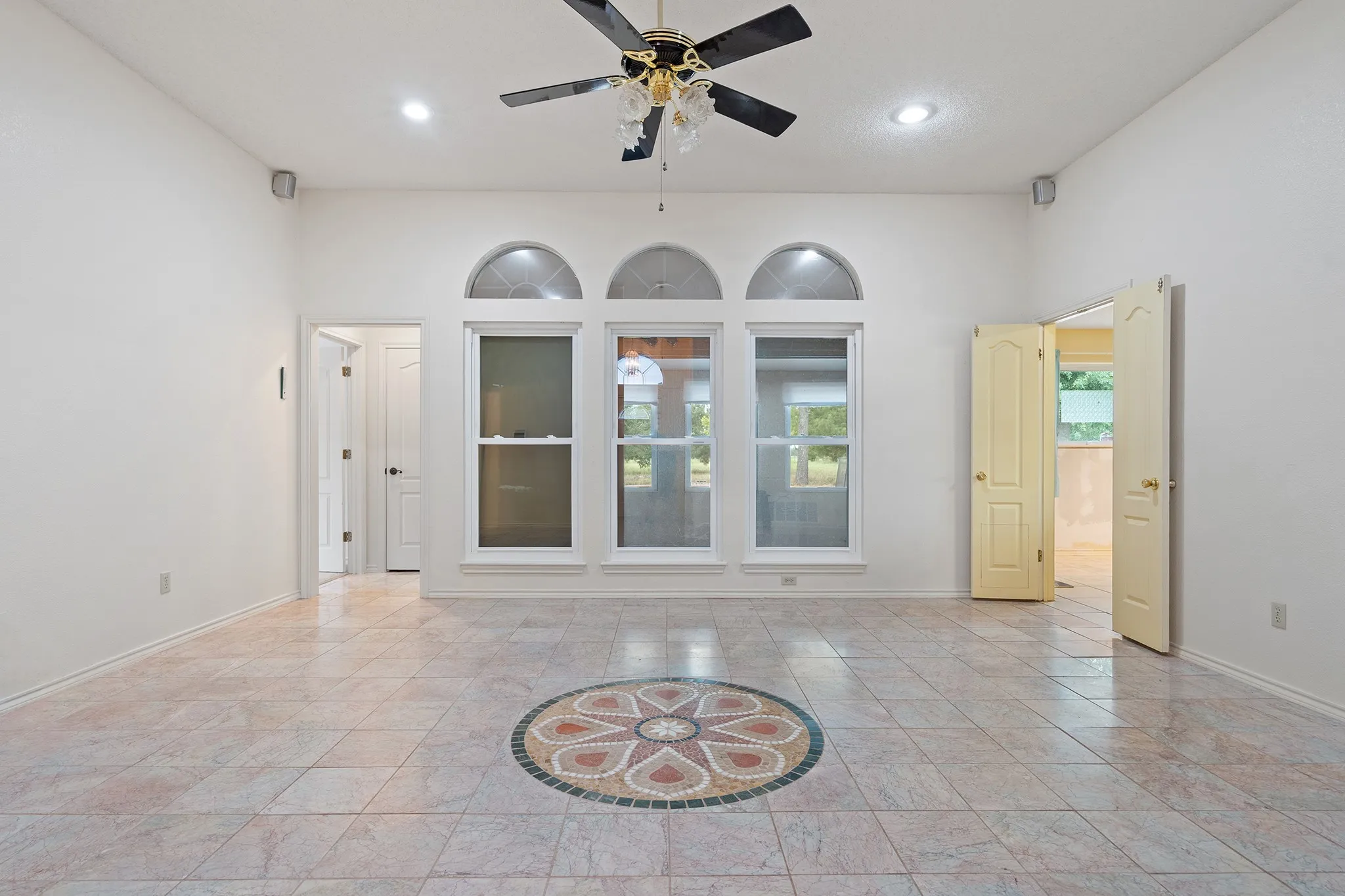 Look out over the back yard through the sunroom.
