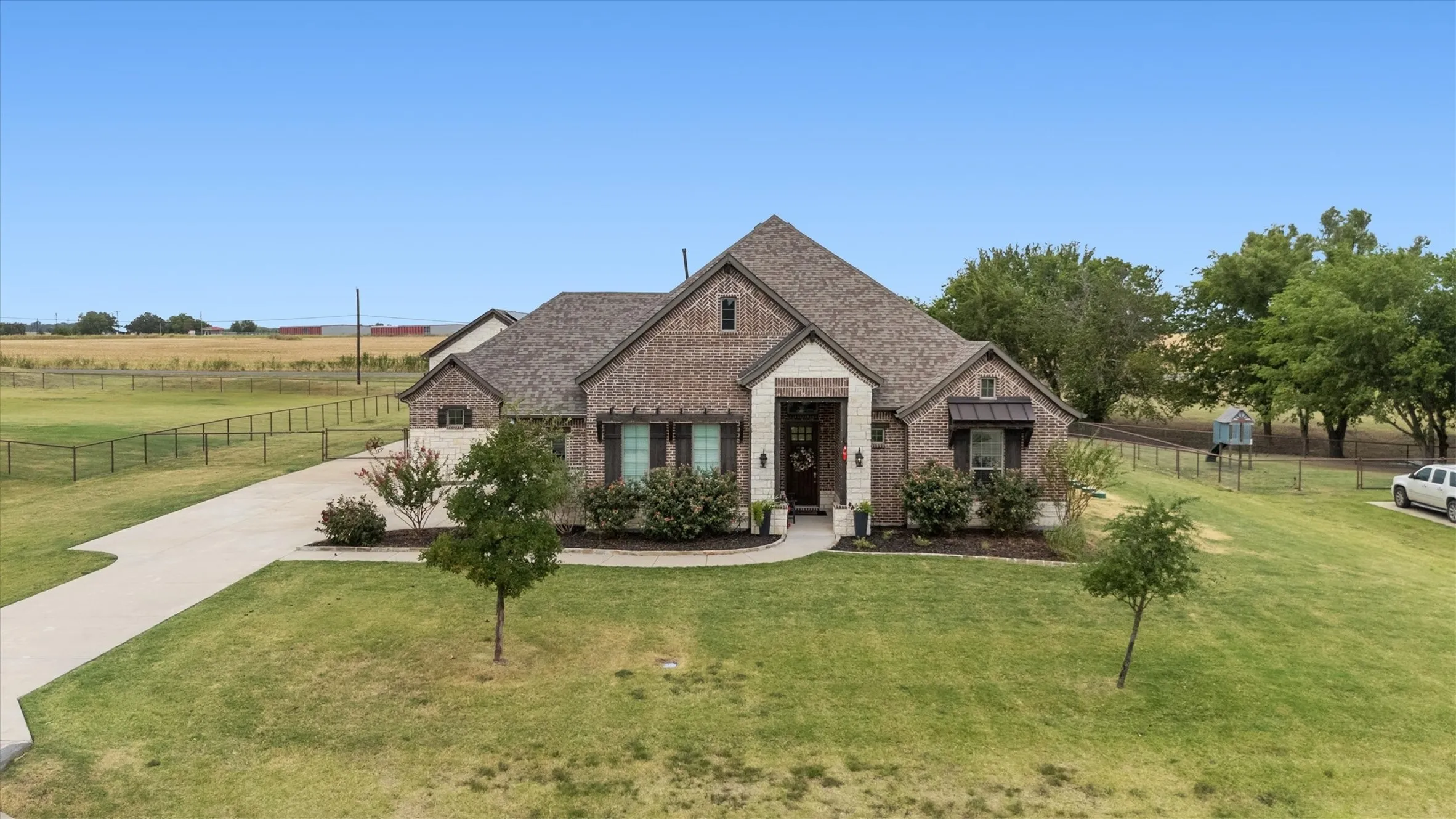 Long driveway, side entry garage, beautiful curb appeal.