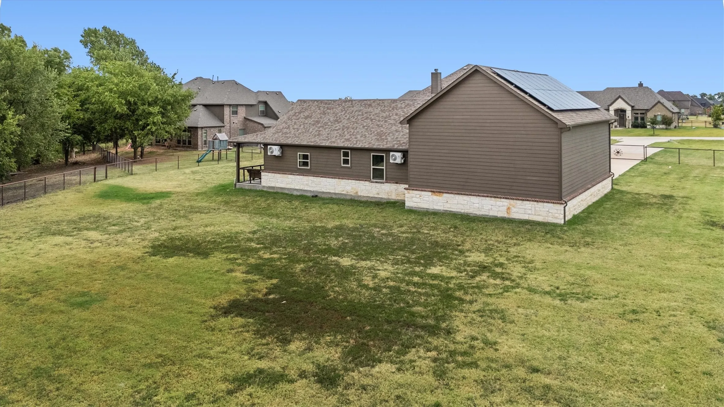 Aerial view of the guest house/ADU showing pipe fenced backyard with plenty of space to play, garden, there's endless outdoor possibilities.