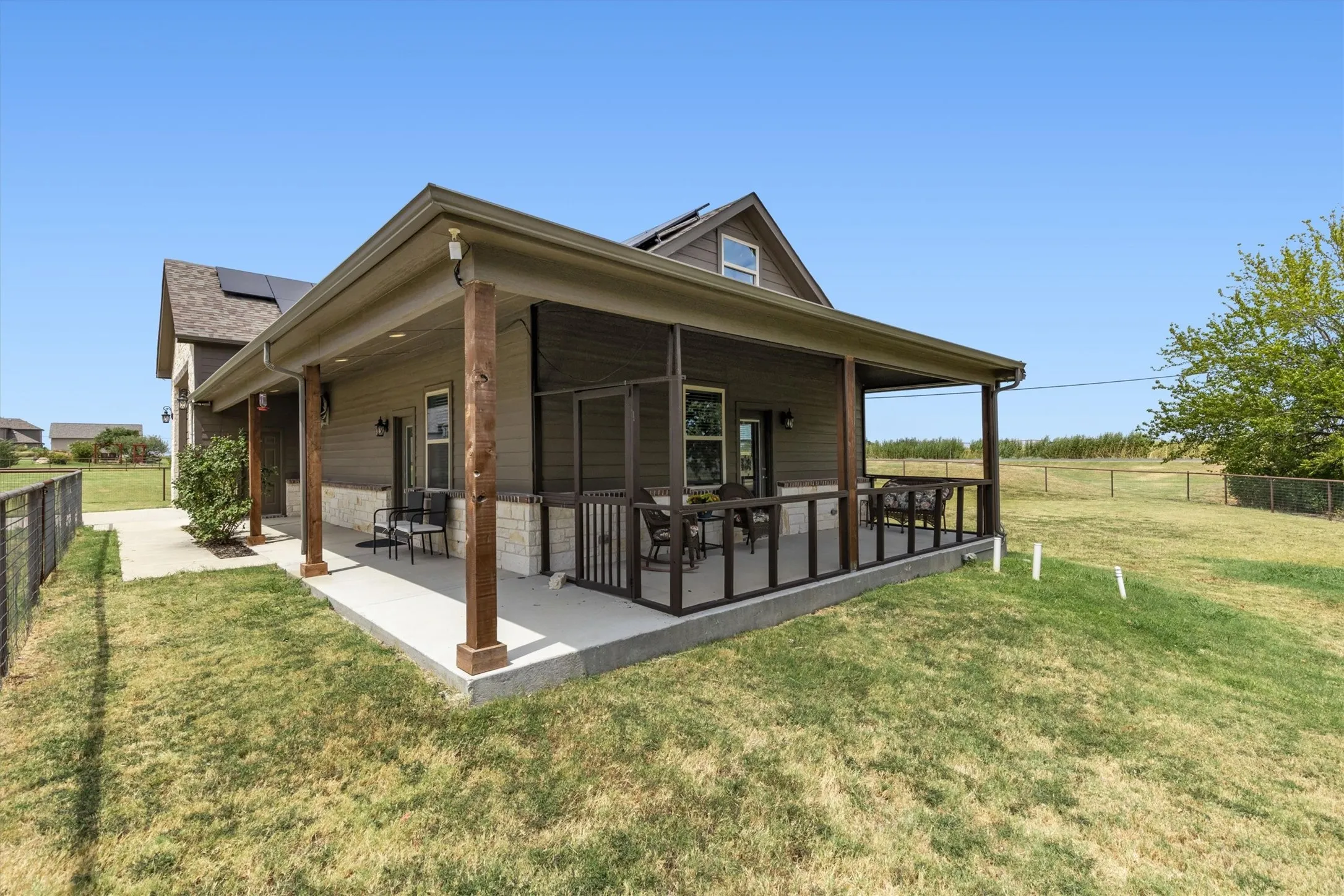 Charming guest house with a wraparound porch. Two seperate entrances and an attached garage/shop with seperate access.
