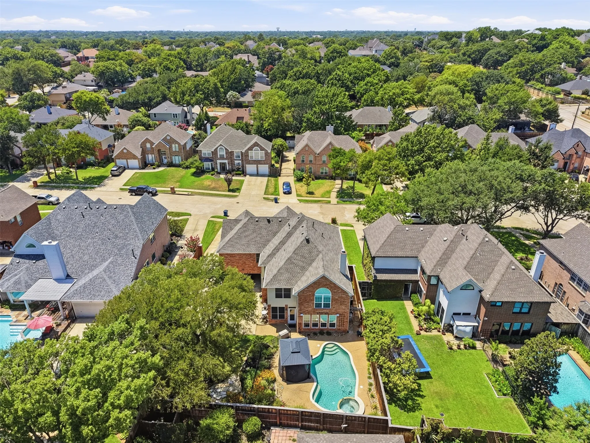 Expansive residential neighborhood featuring numerous mature trees and substantial properties