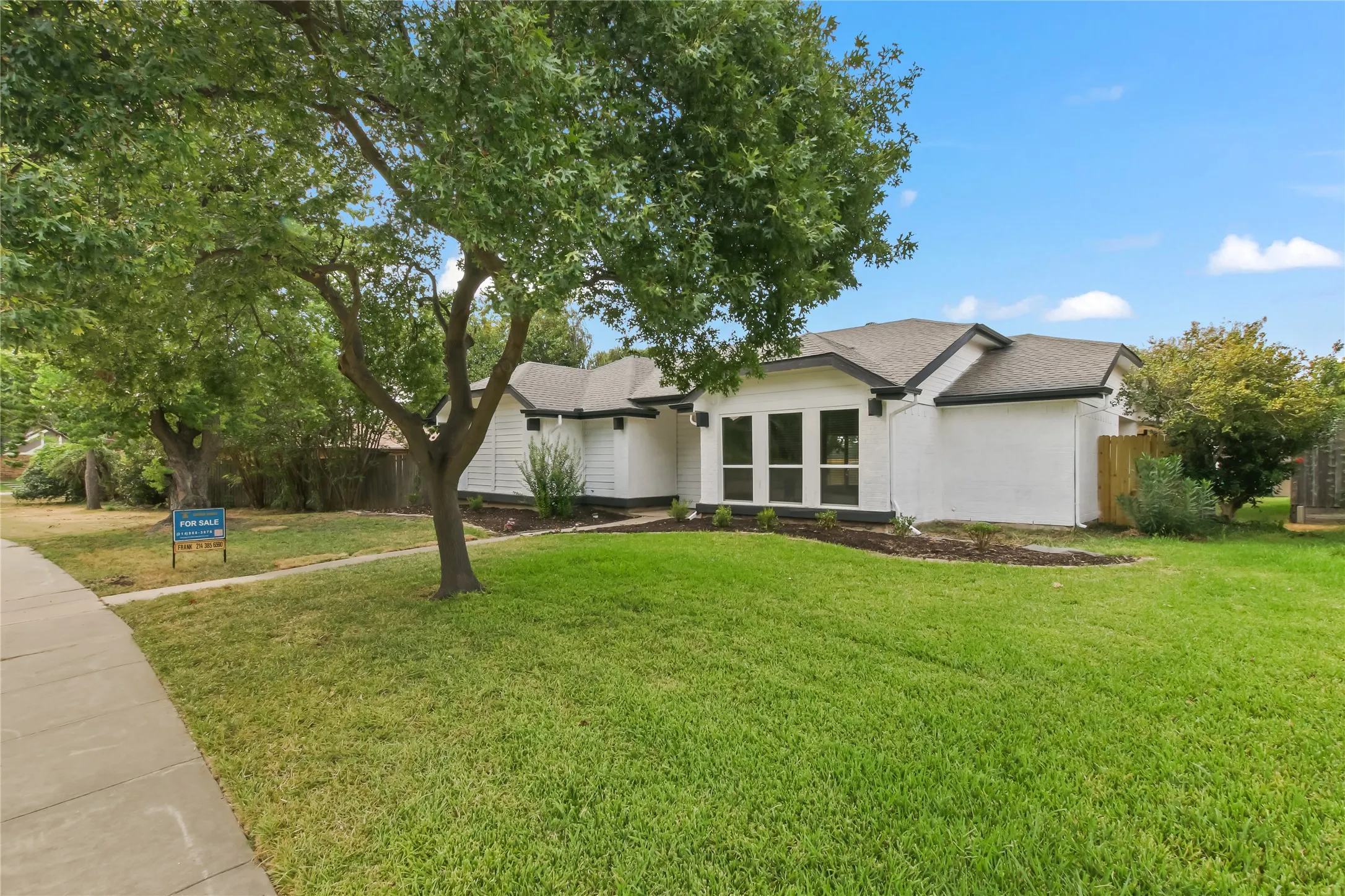 Charming single-story residence with a classic exterior featuring stone and stucco finishes