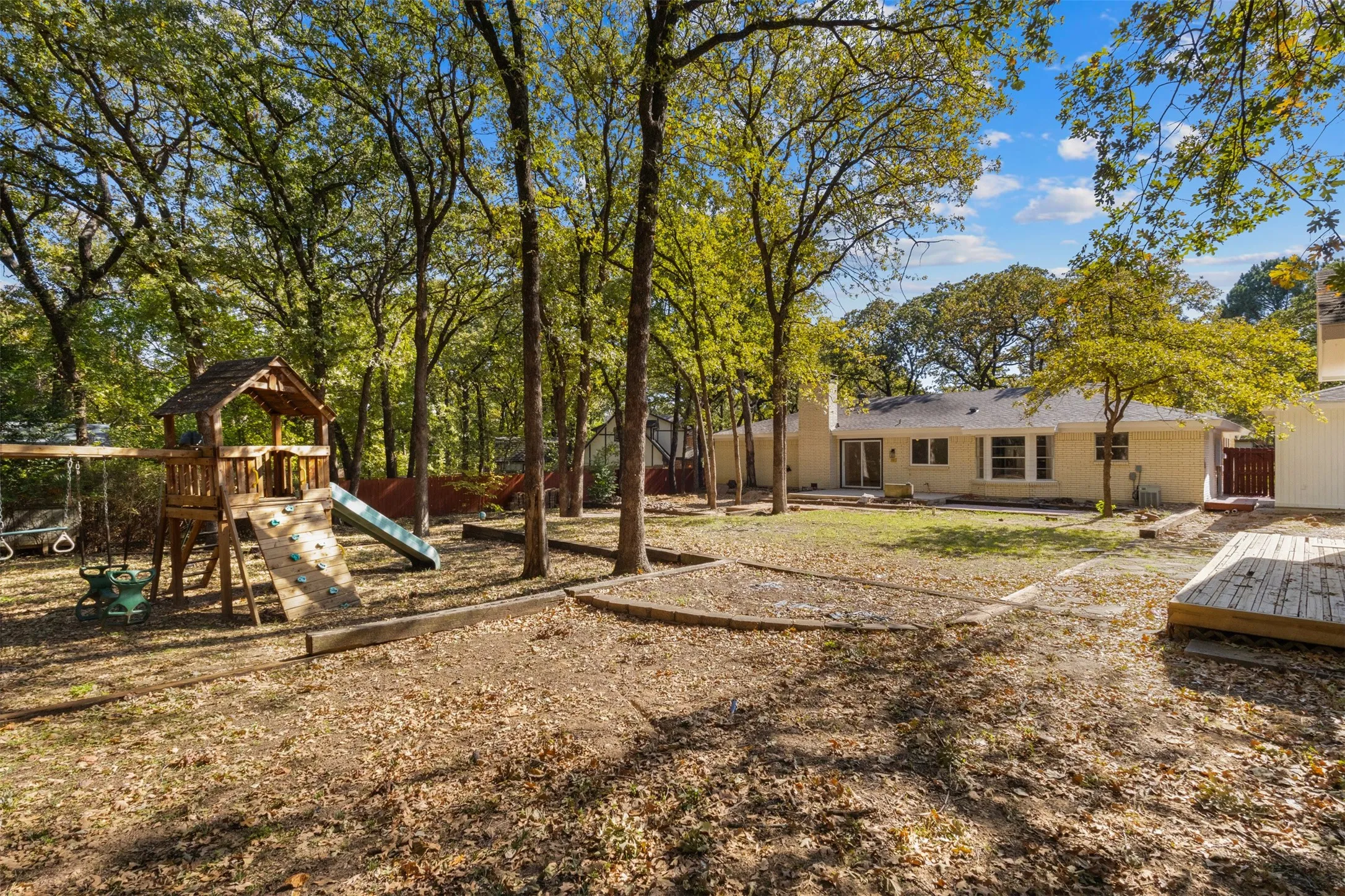 View of yard with a playground and a patio area