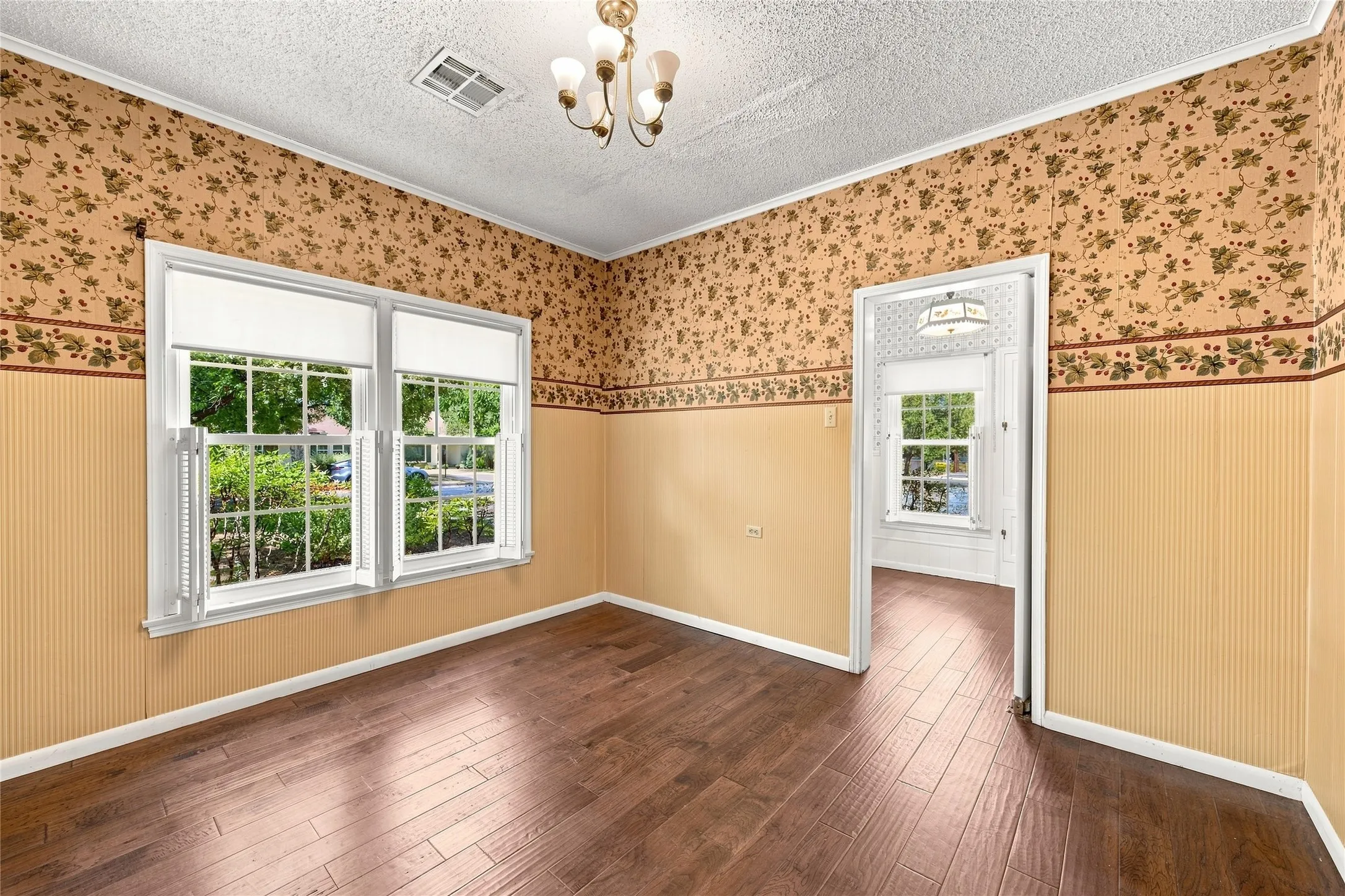 Wood-finish flooring with a decorative wall covering and wainscoting