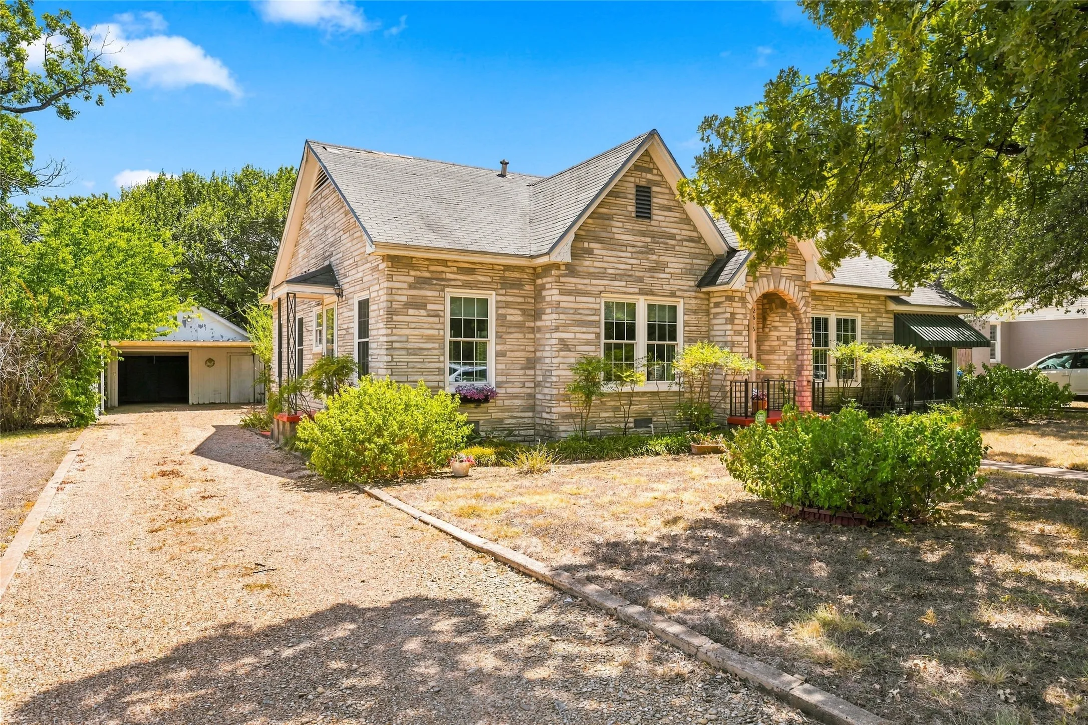 Stone exterior featuring a gabled roofline