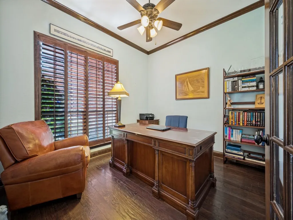 Private Study featuring dark wood plantation shutters.