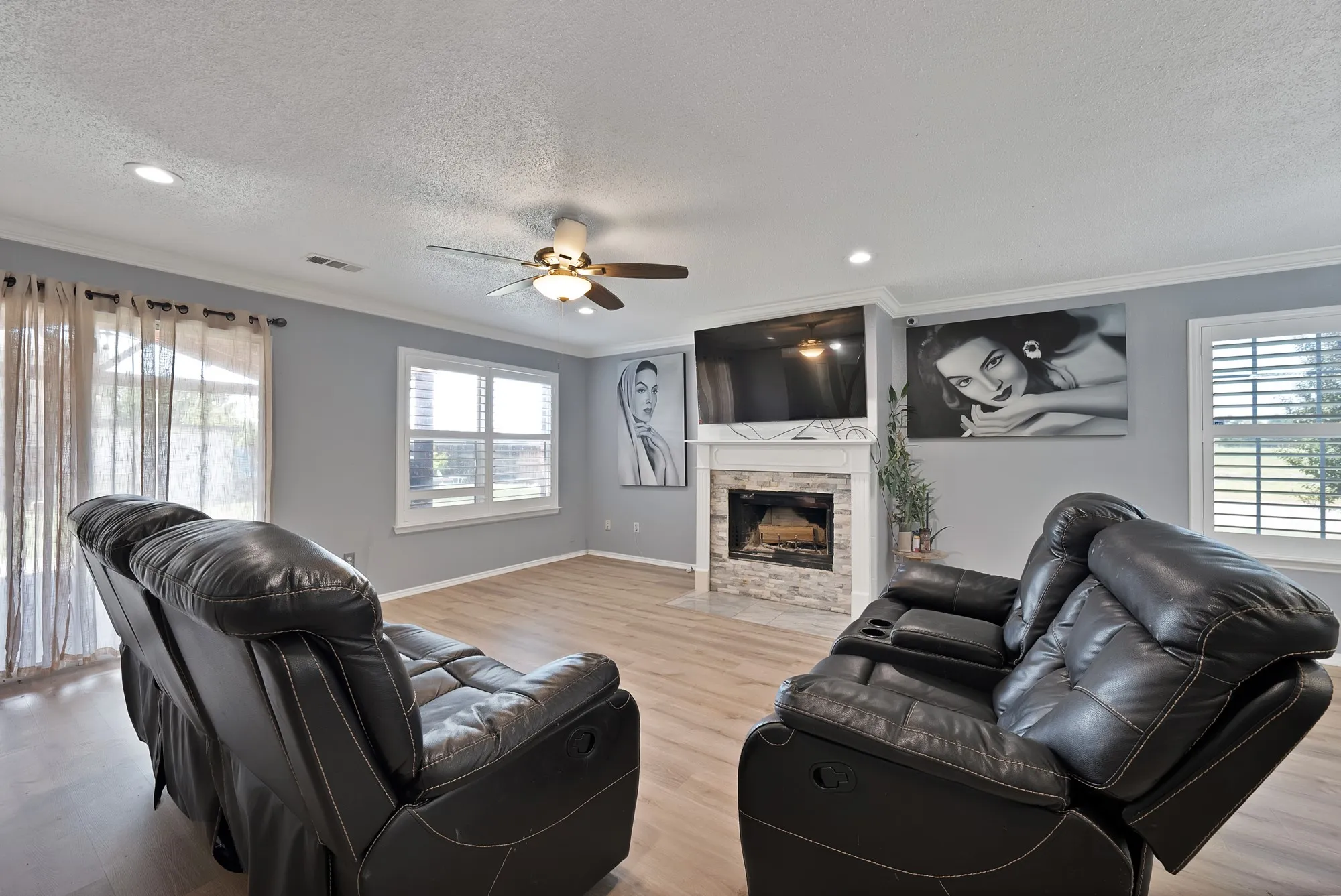 Wood-finish flooring, recessed lighting, and a ceiling fan