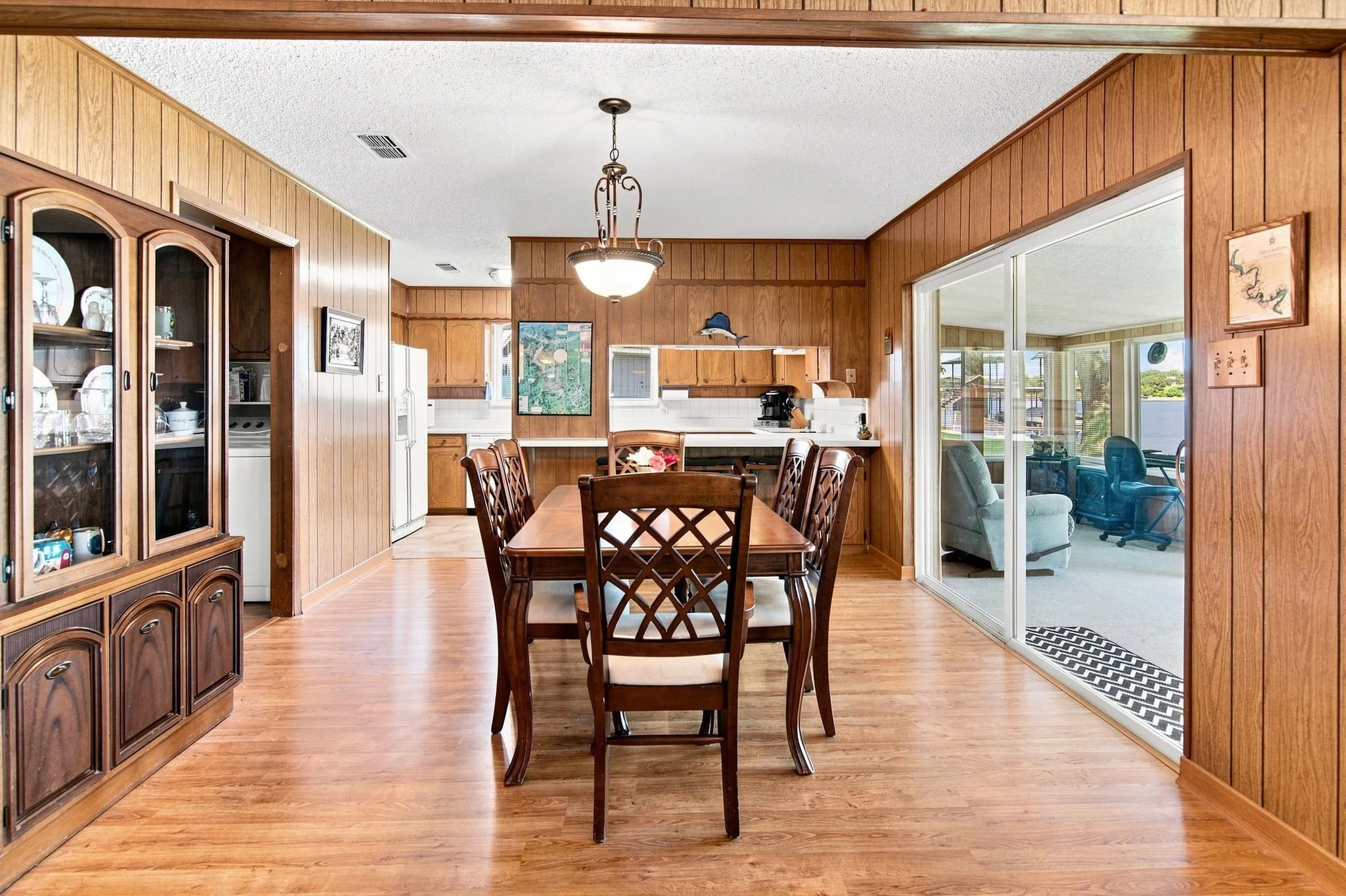 Wood-finish flooring throughout, with paneling and built-in cabinetry