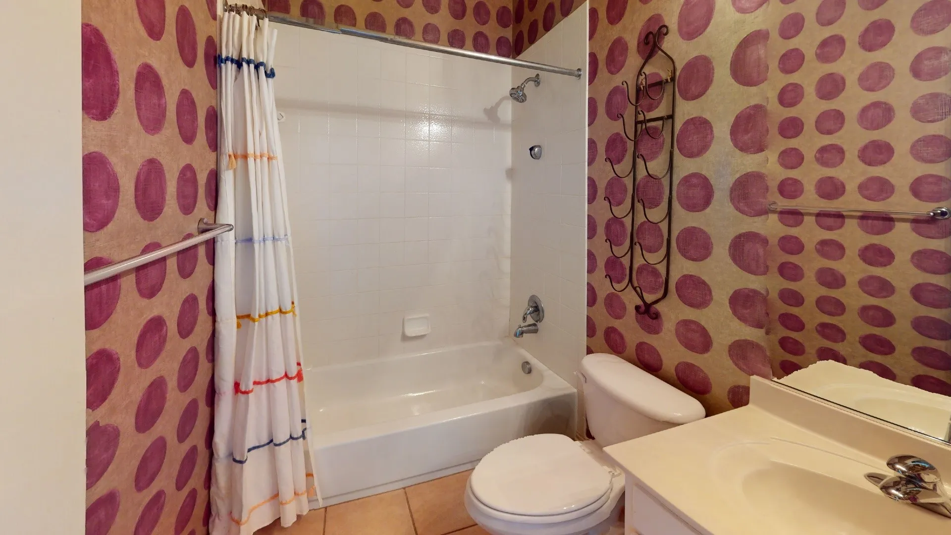Built-in bathtub with shower, toilet, and vanity with integrated sink