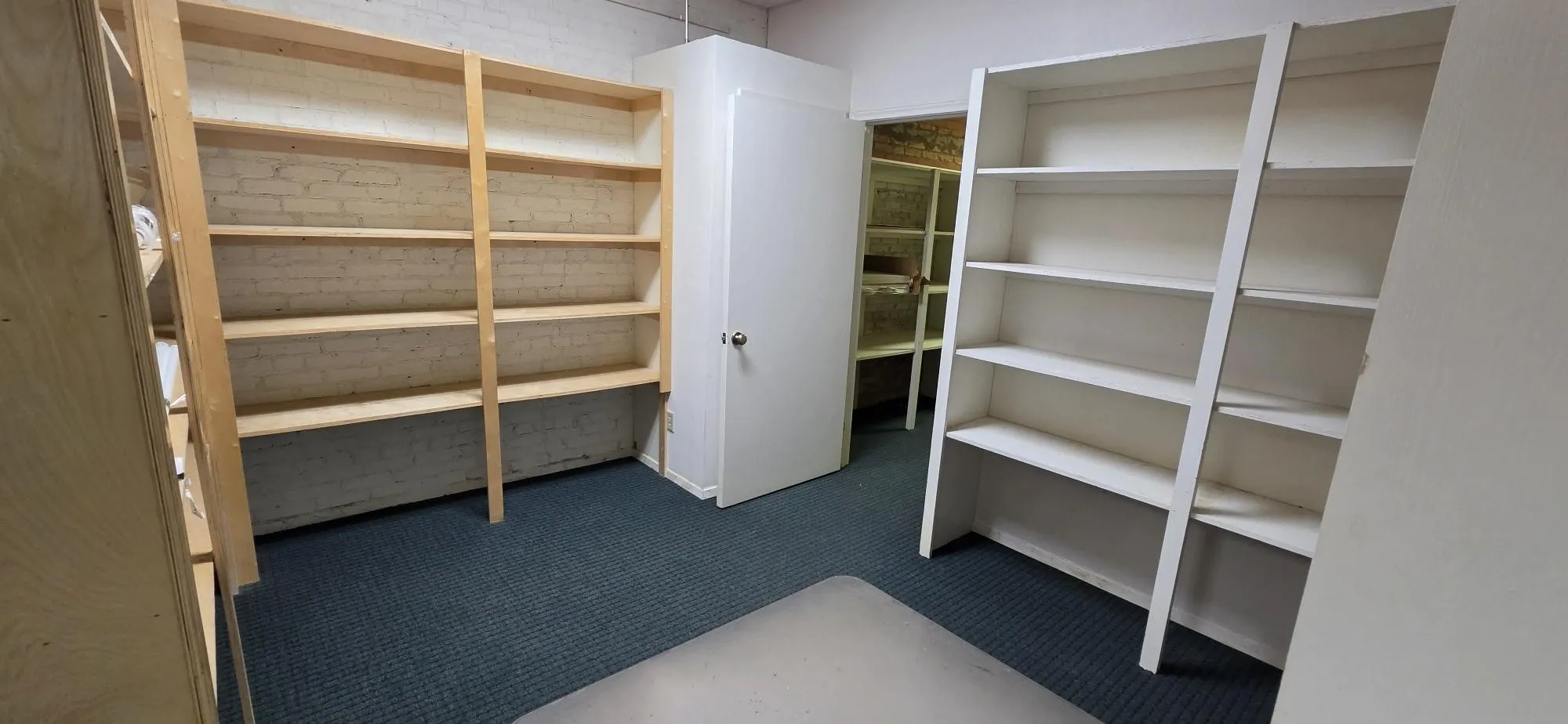 Back shelving right before storage closet