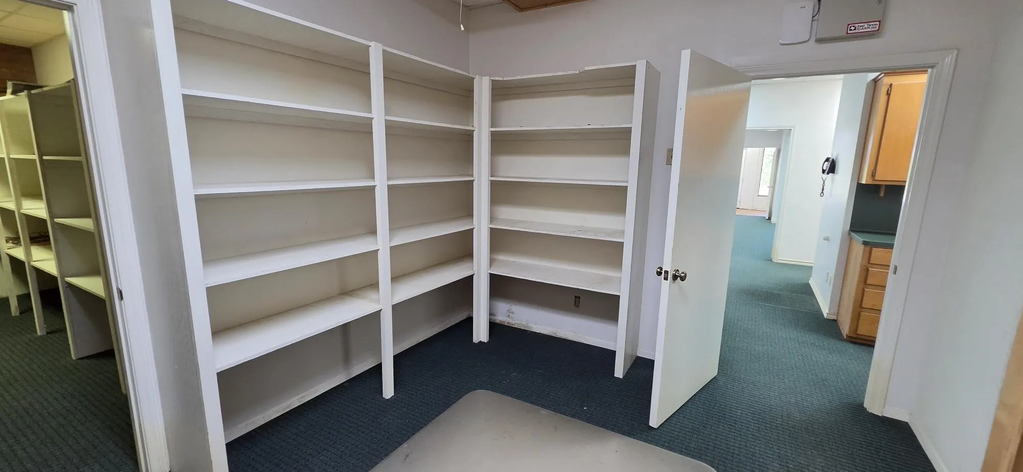 Back shelving right before storage closet