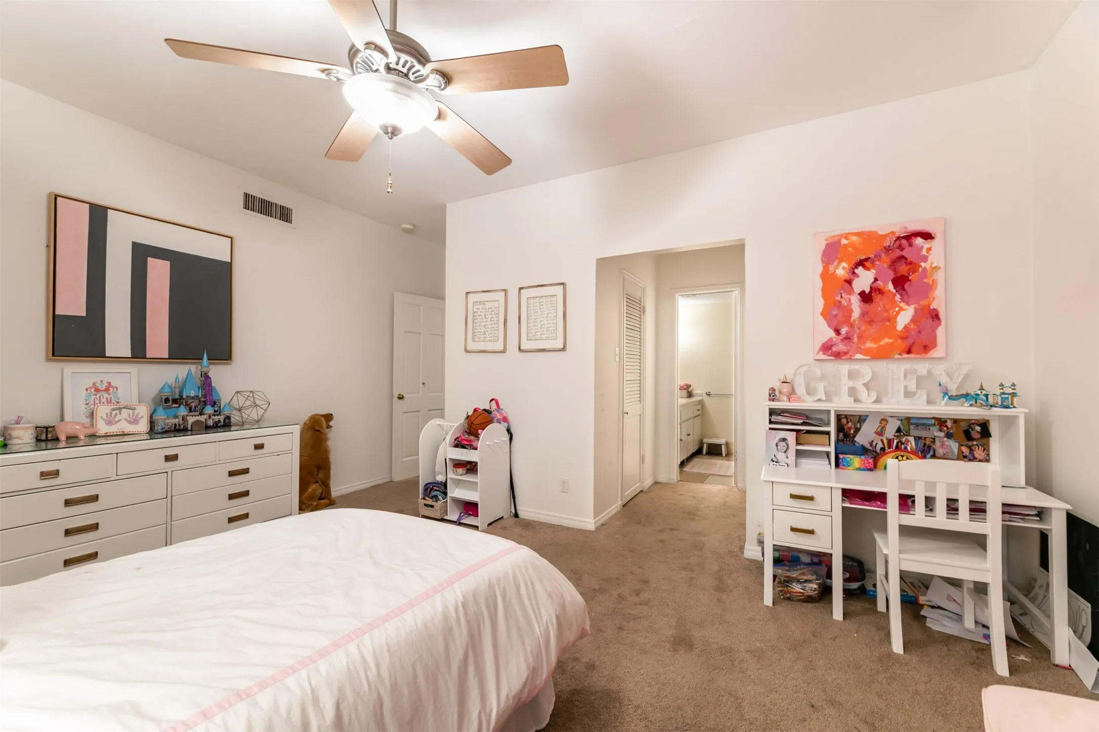 2nd BedroomCarpeted room with a ceiling fan, white walls, and a doorway leading to 2nd Bathroom