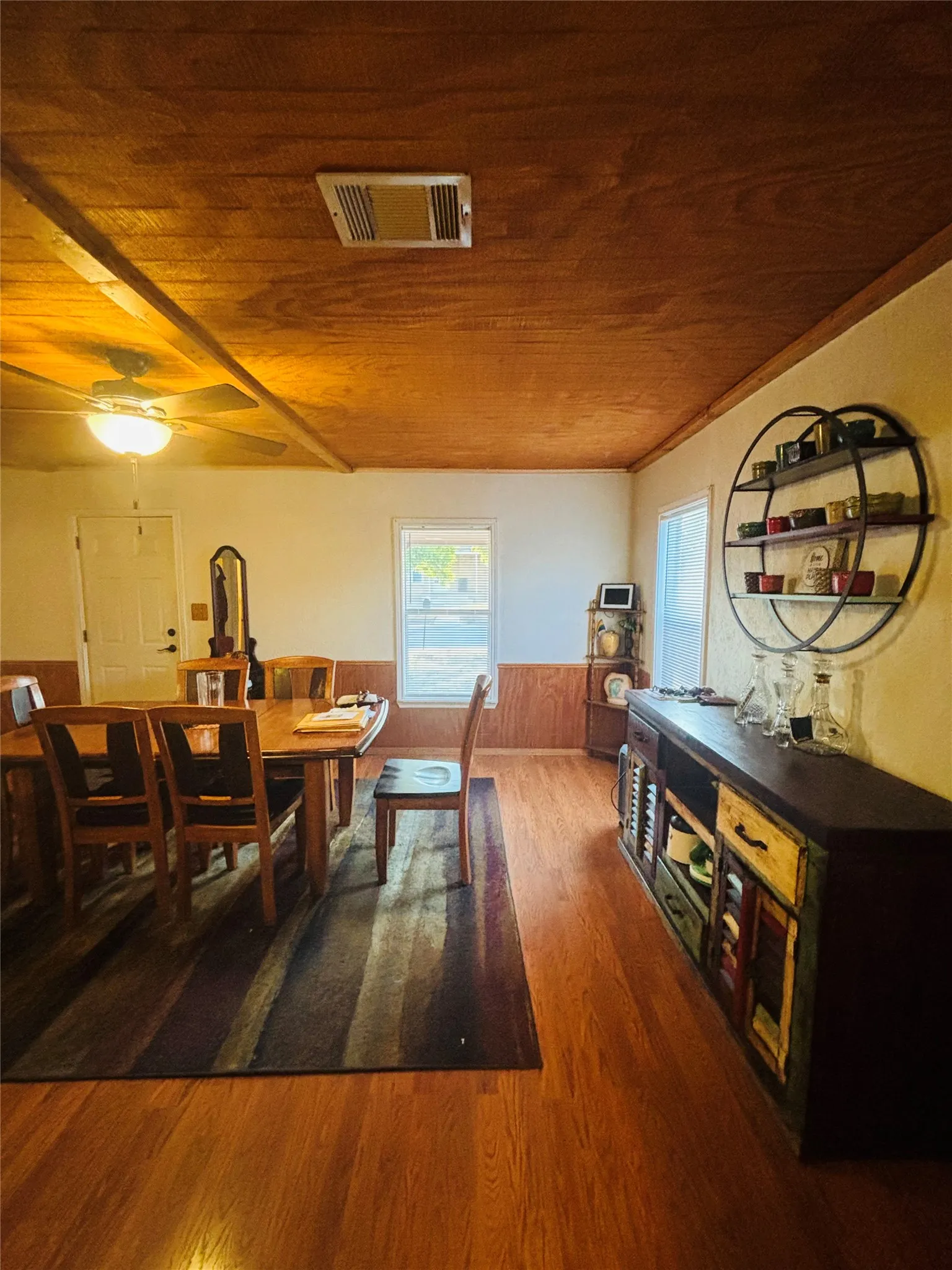 Wood-finish flooring with wood paneling accents