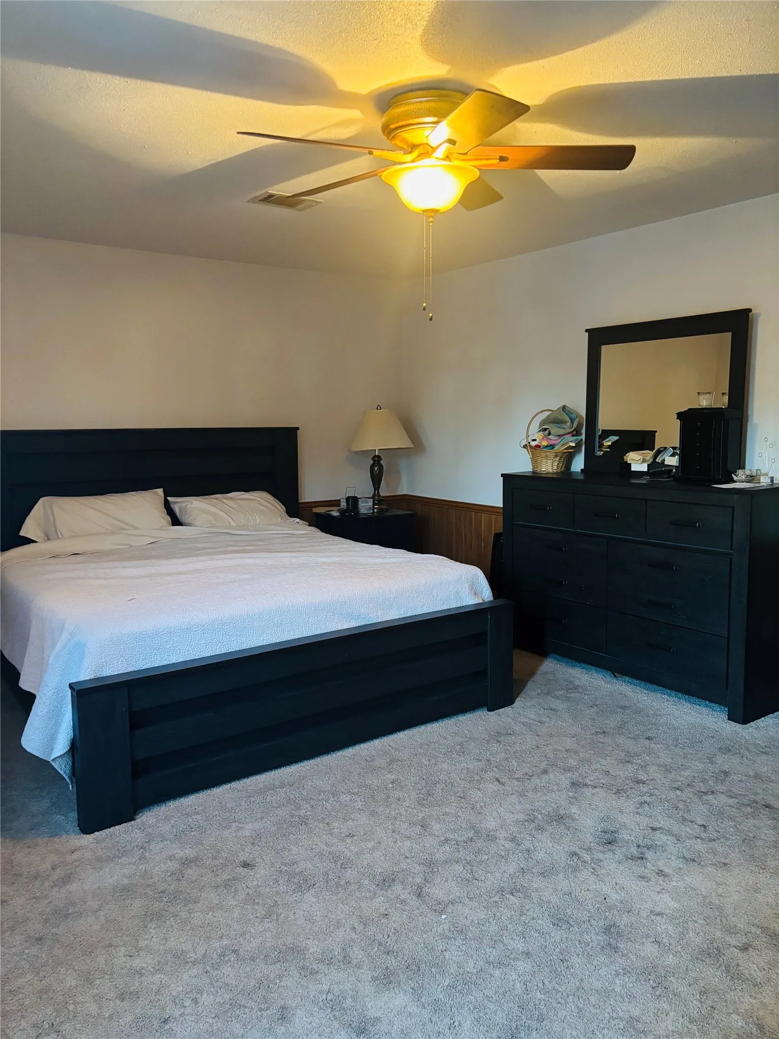 Neutral wall paint with wood paneling accent