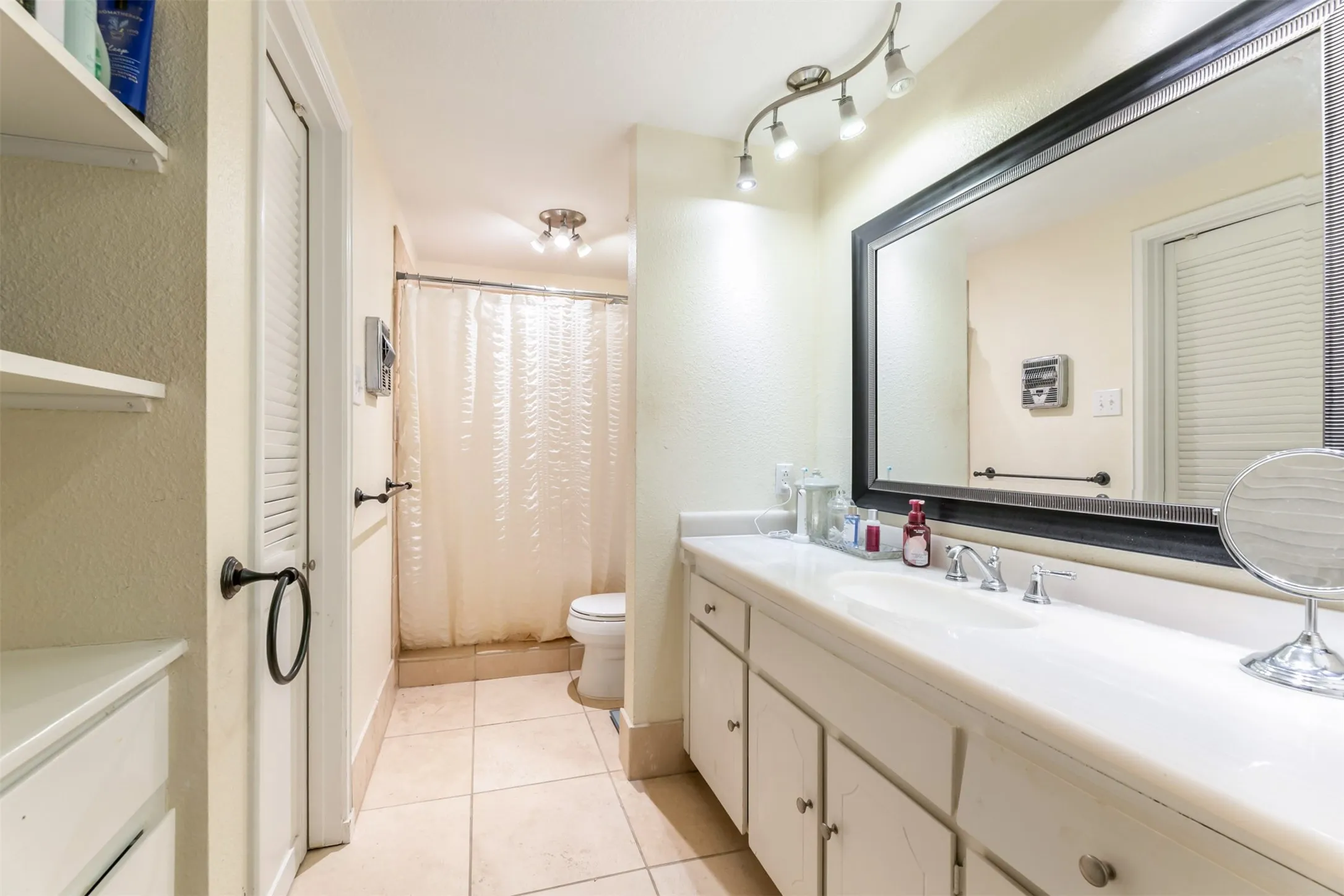 Double vanity with a white countertop and integrated sinks