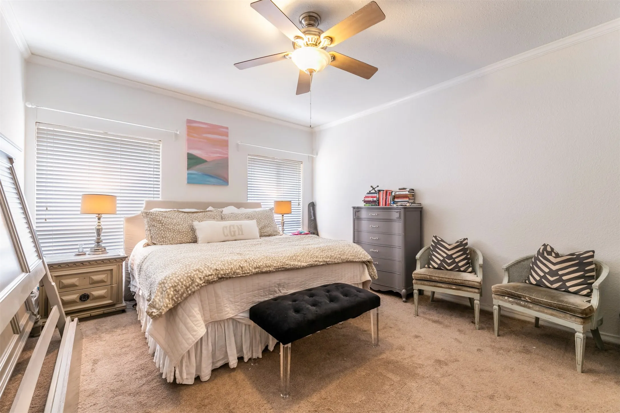 Recessed windows with blinds, ceiling fan with light fixture, and crown molding