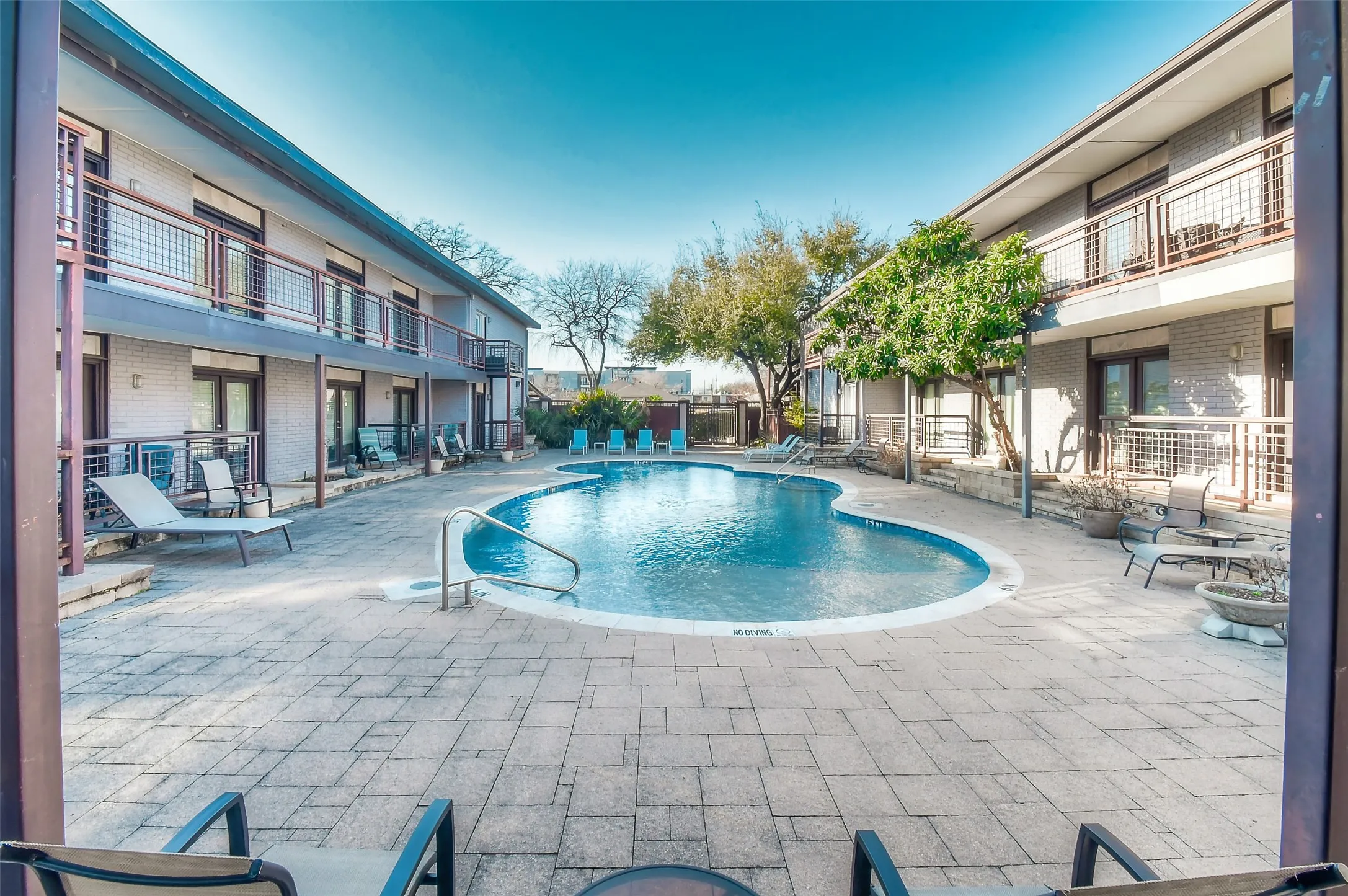 Pool featuring a patio and fence