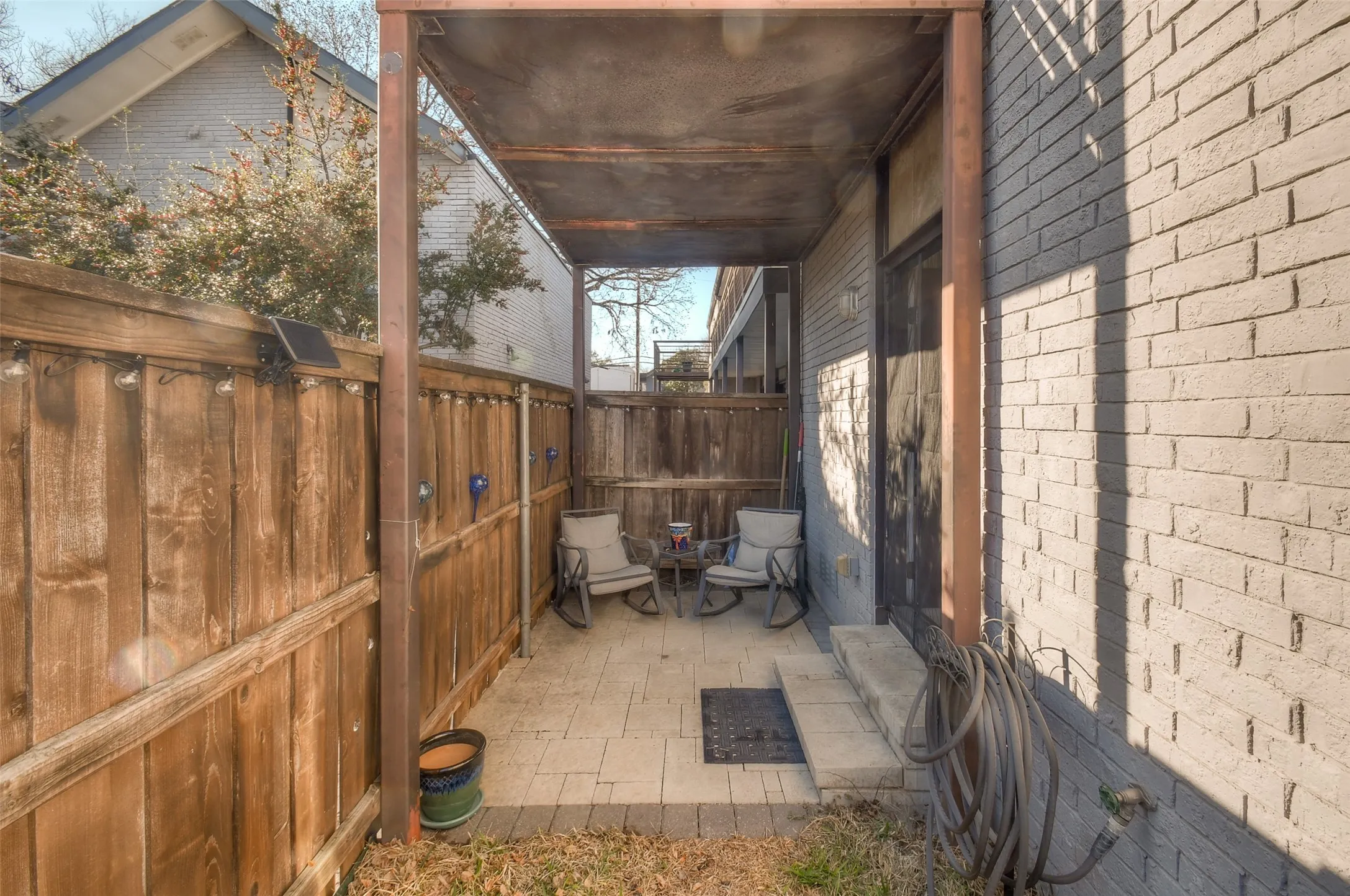 View of patio with fence