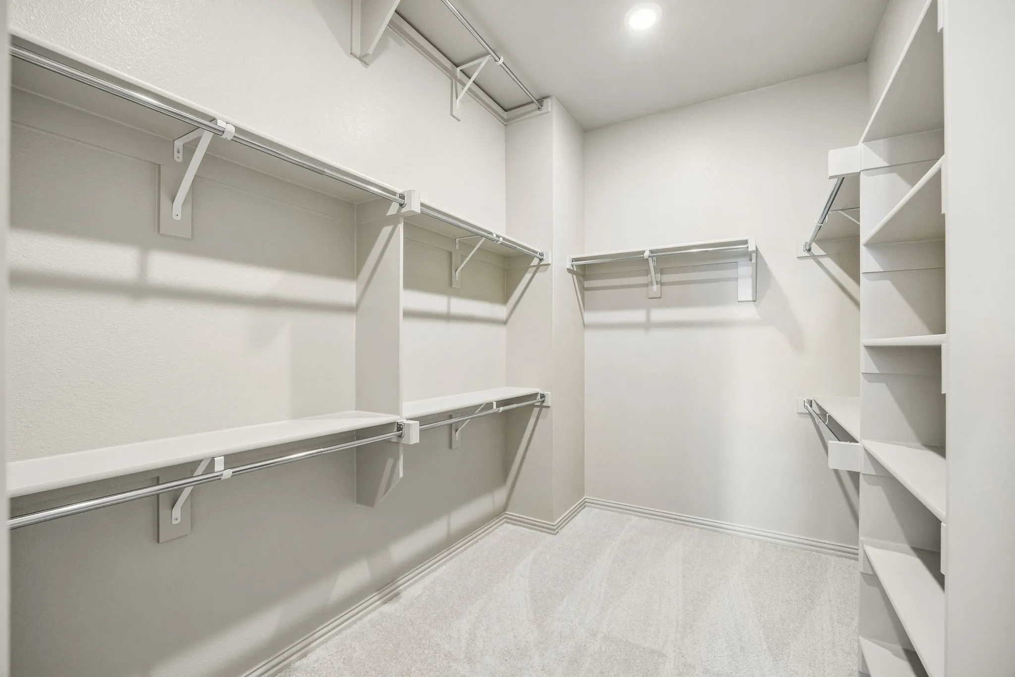 Featuring seasonal hanging rods and plenty of space to spread out, your dream owner's closet awaits!