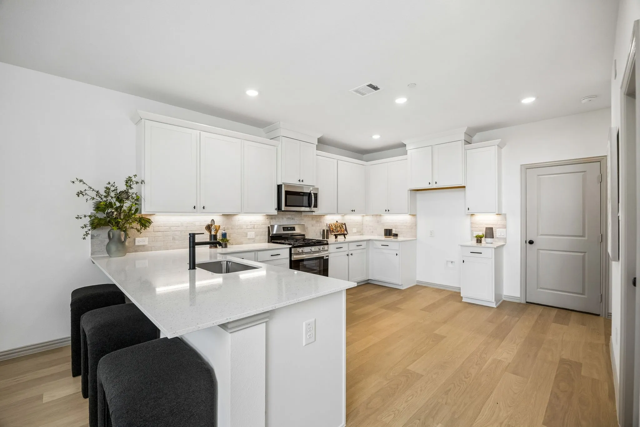 The kitchen peninsula with breakfast bar makes this the perfect place to grab a quick bite.