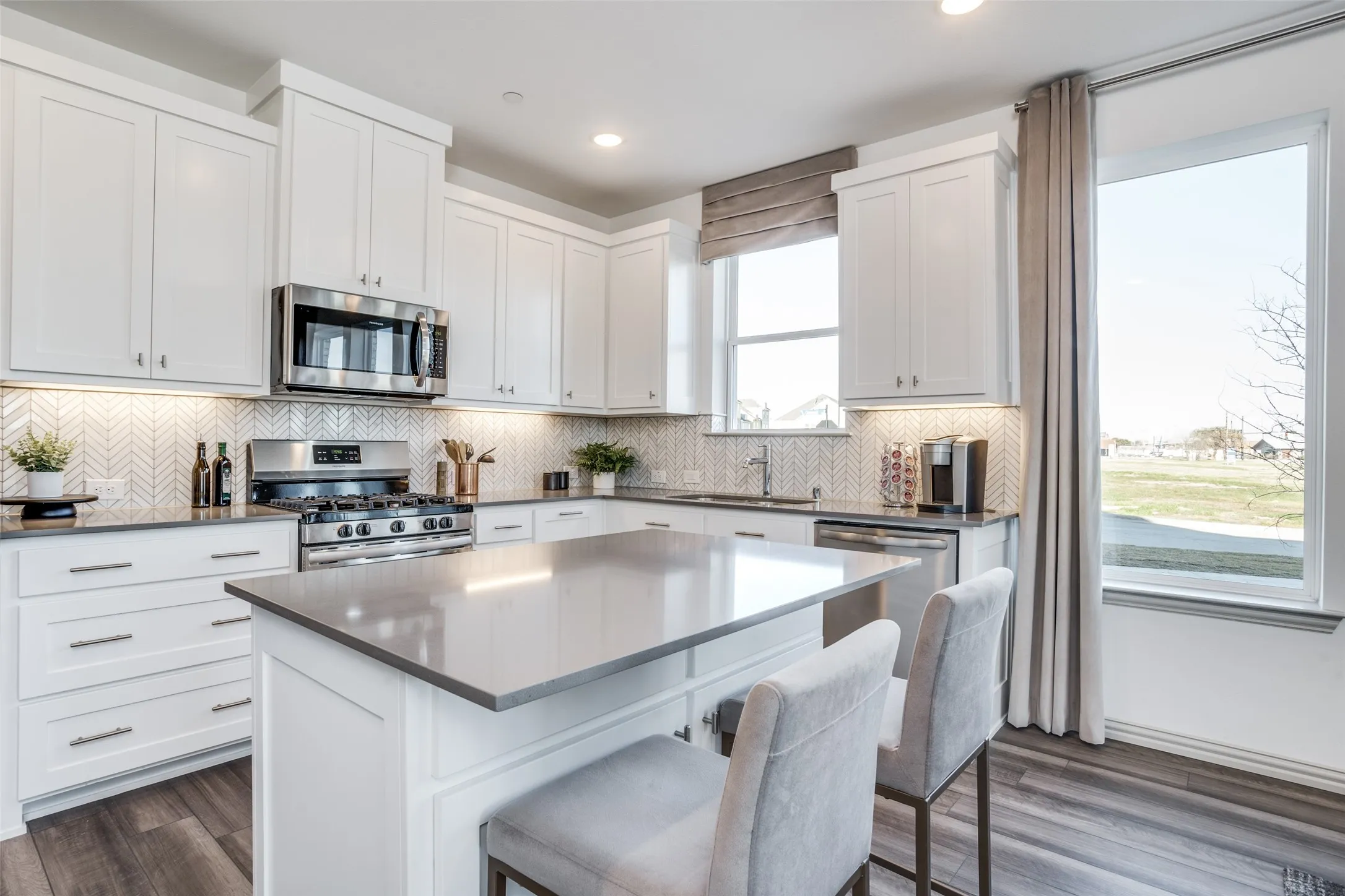 Featuring ample storage and prep space, this dream kitchen is both beautiful and functional!