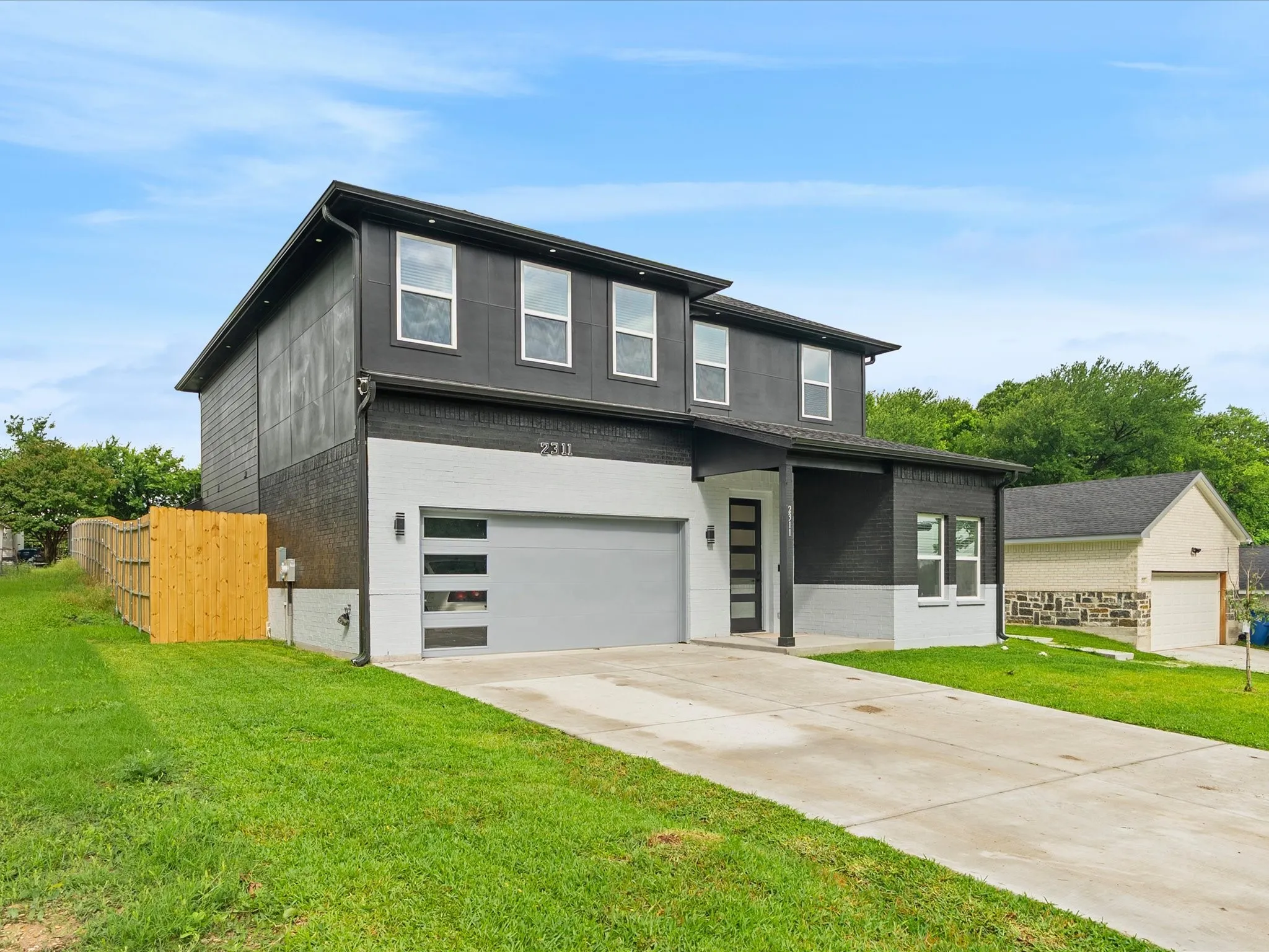 Contemporary two-story exterior with a two-tone facade