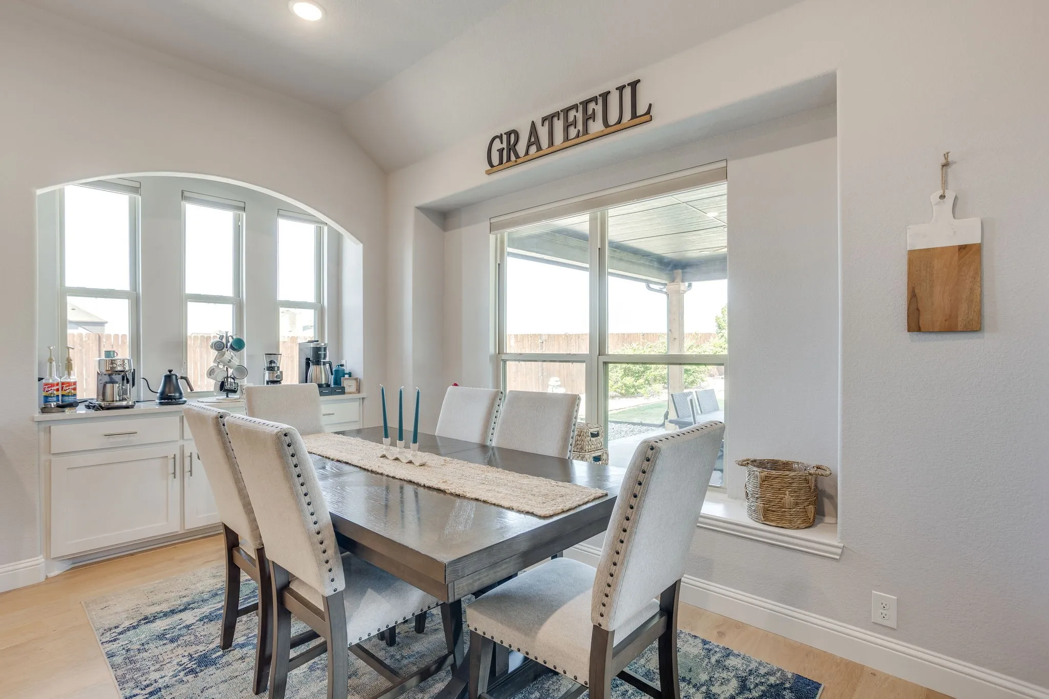 Arches, window seat overlooking backyard