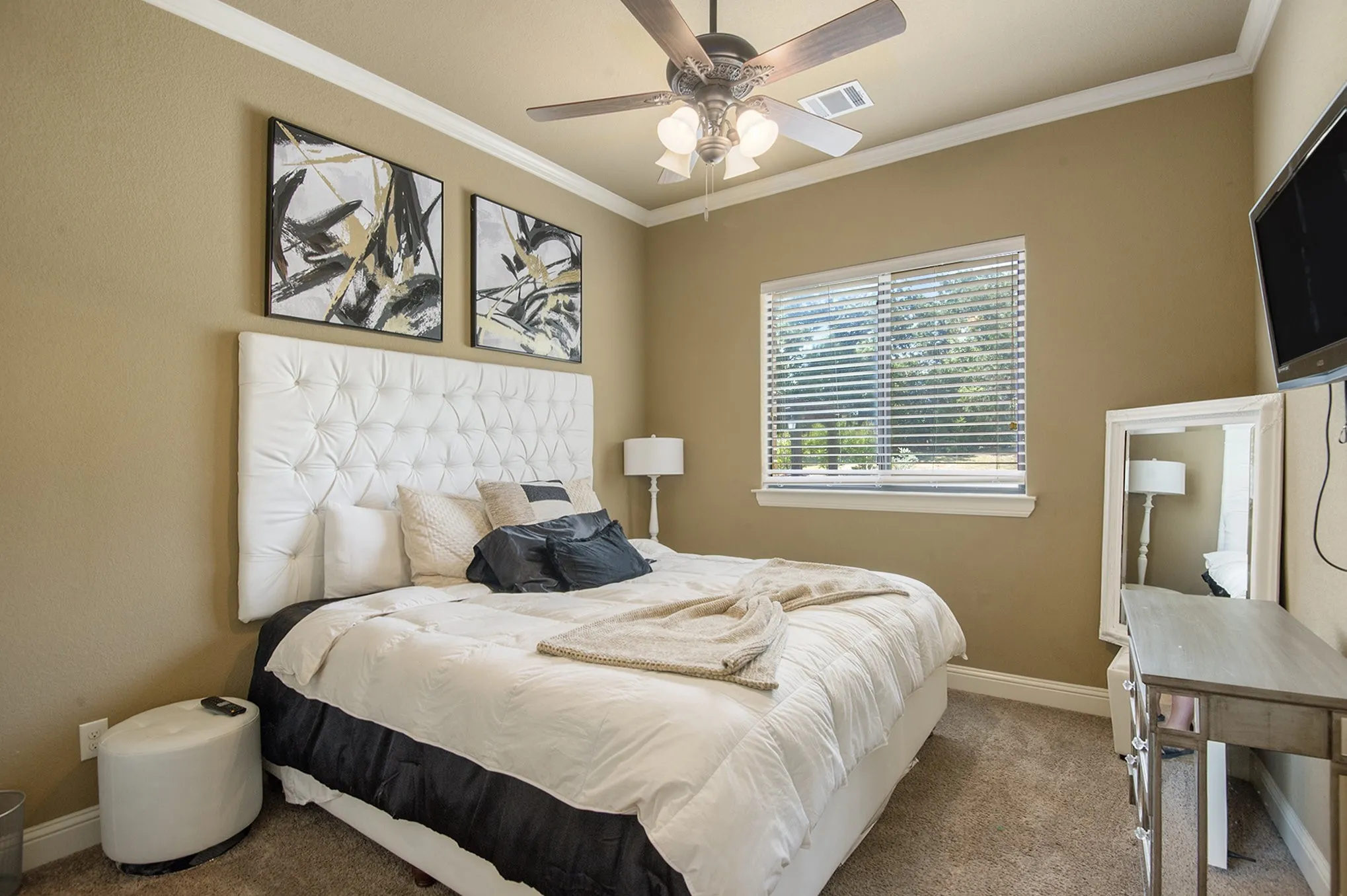 Guest bedroom on 1st floor- Plush carpeted flooring, a window with horizontal blinds, and a ceiling fan with integrated lighting