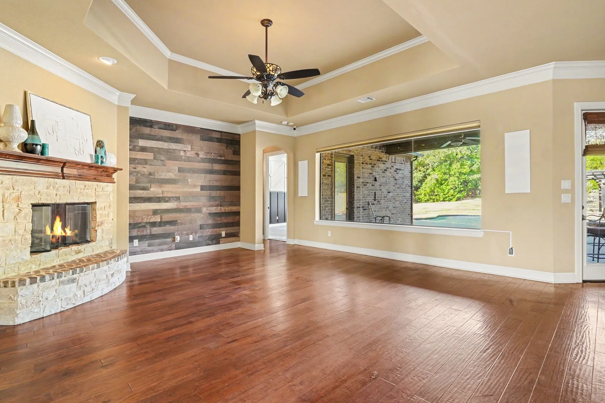 Stone-faced fireplace with a wood mantel