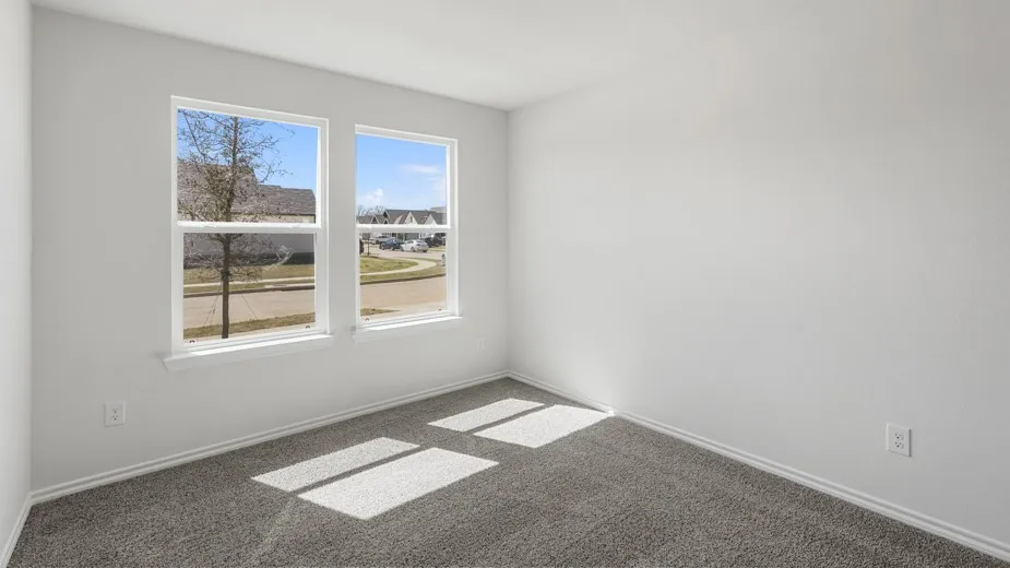 Neutral wall finish with light gray carpeting