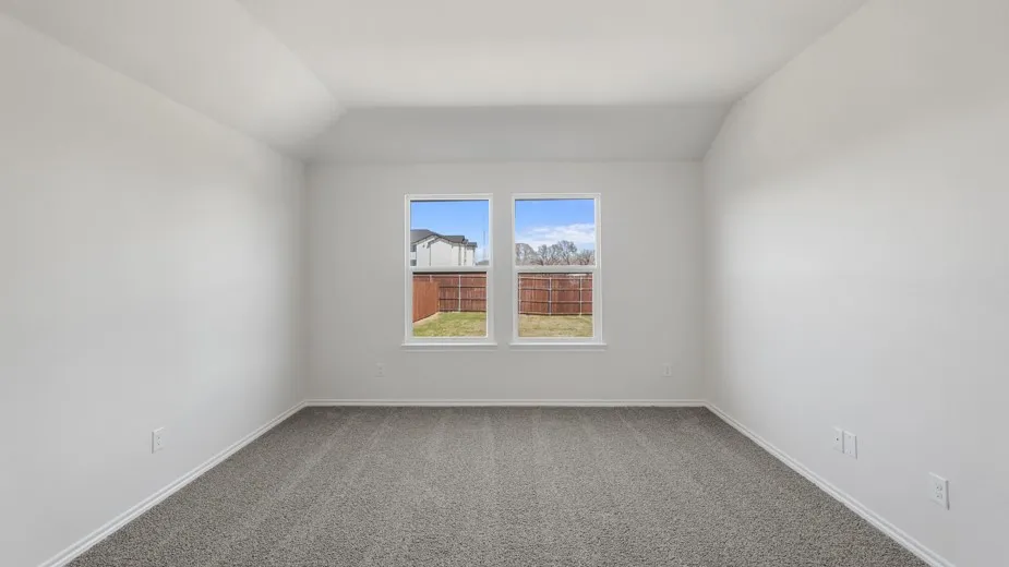 Neutral wall paint with tray ceiling, grey carpet flooring, and dual windows