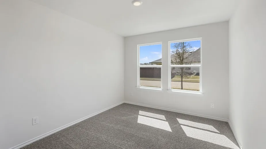 Neutral wall color, recessed lighting, dual windows, gray carpet flooring, white trim