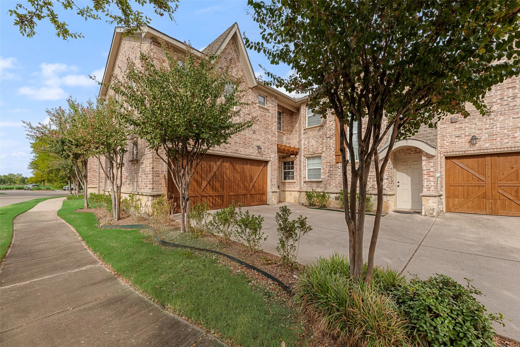 Brick exterior with stone accents and gabled rooflines