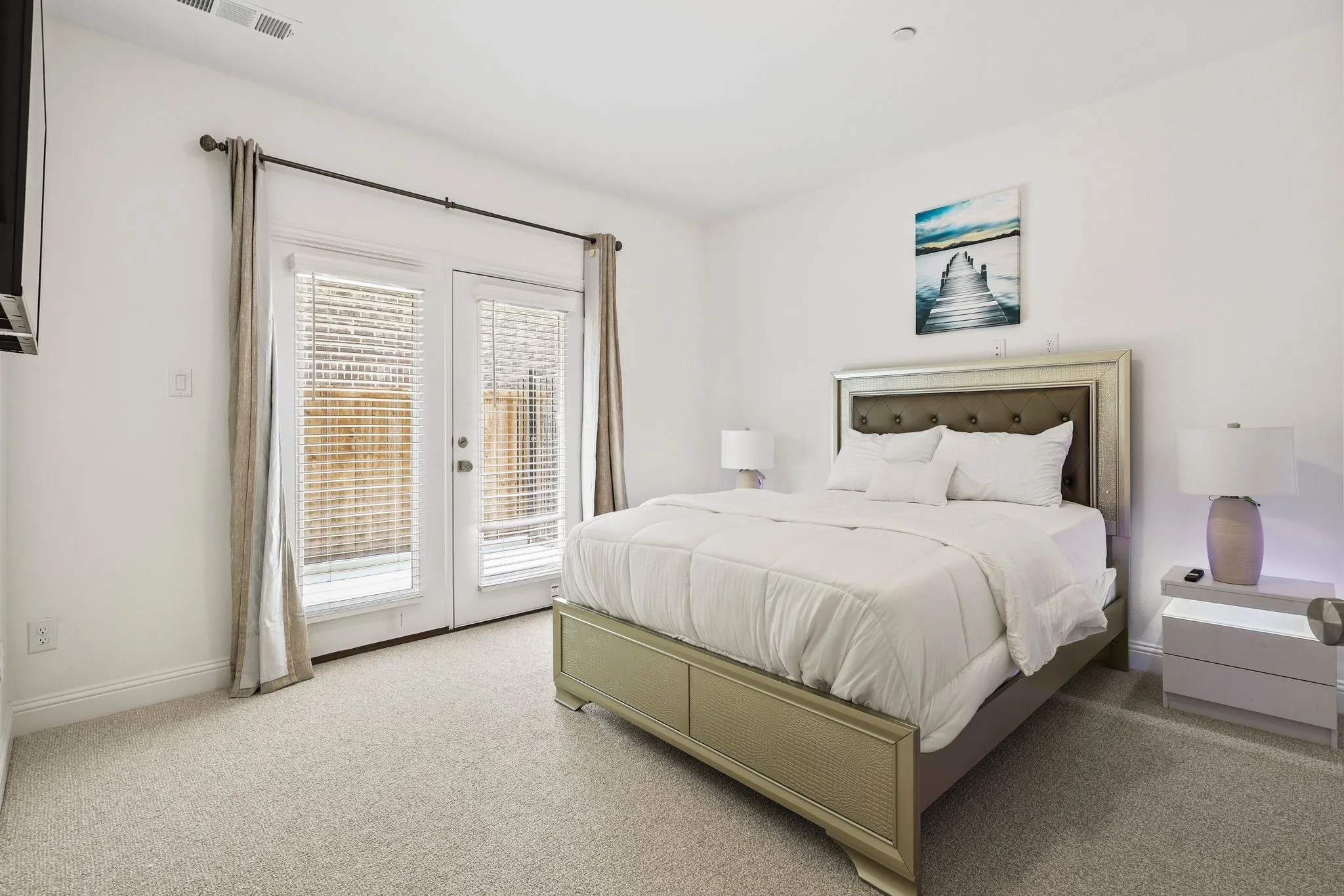 Bedroom with french doors, carpet floors, and access to outside