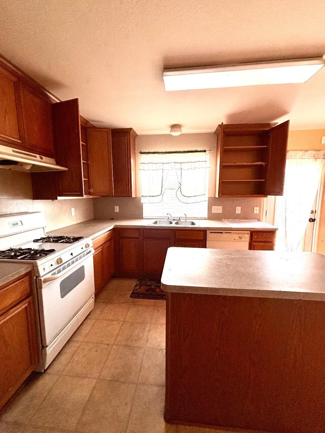 Kitchen with gas range.