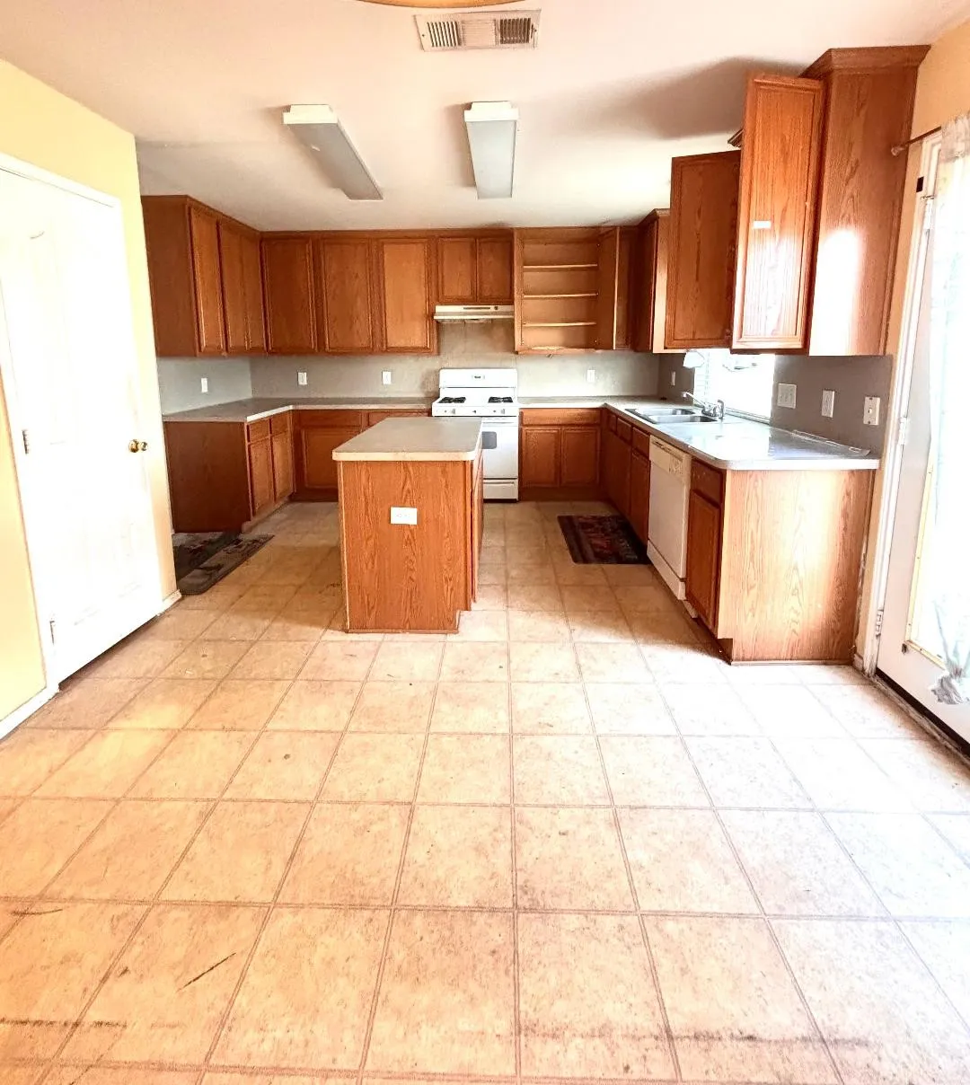 Kitchen with island and plenty of cabinet and counter space.