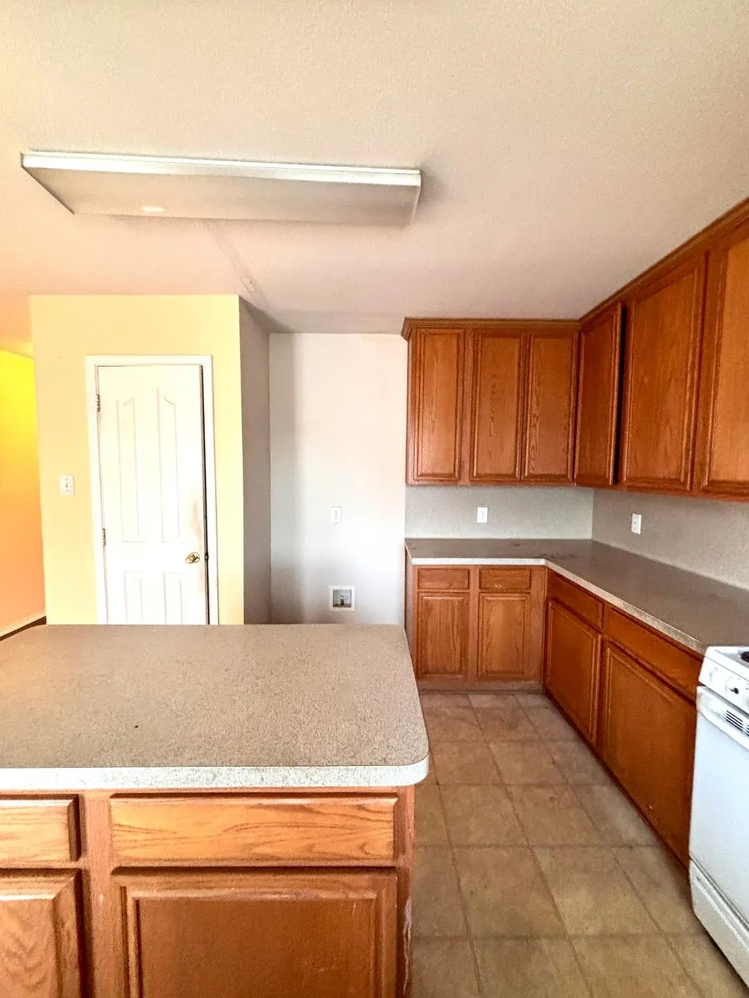 View from kitchen of breakfast area leading to family room.