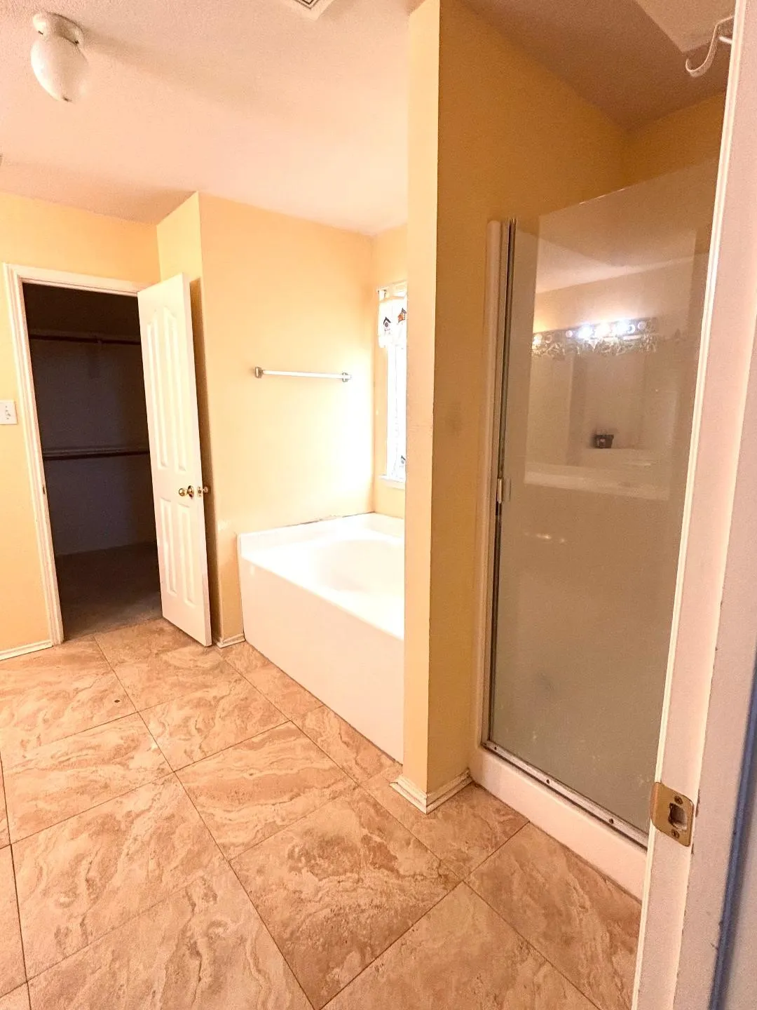 Master bath with garden tub, separate shower and walk in closet.