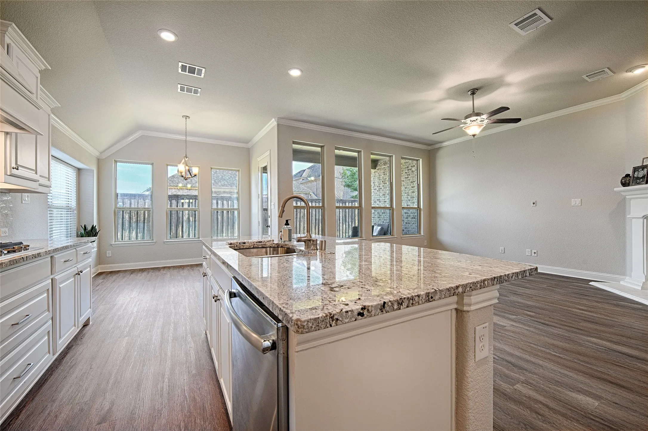 Kitchen island with granite countertop and undermount sink
