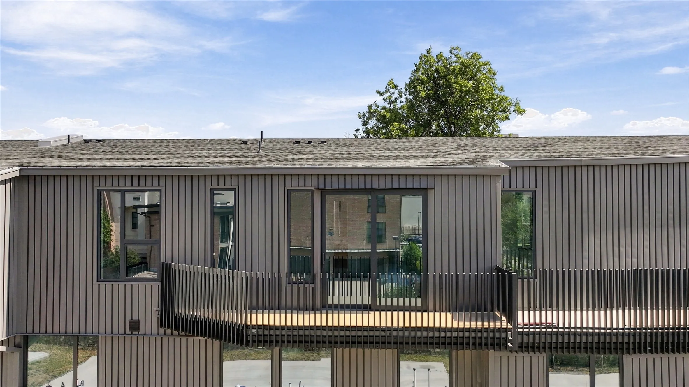 Vertical paneled exterior with a shingle roof