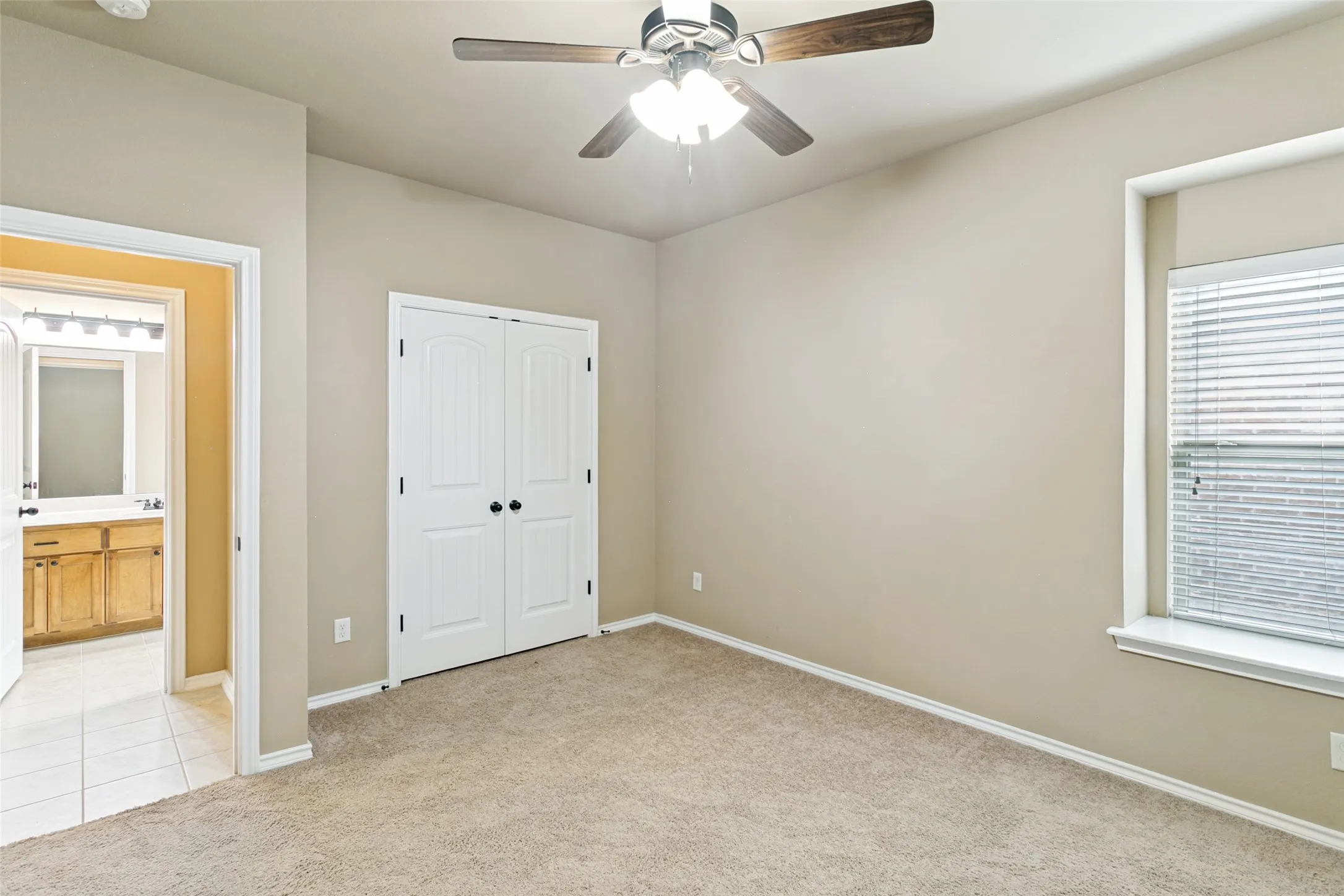 Bedroom and view of bathroom across the hall.