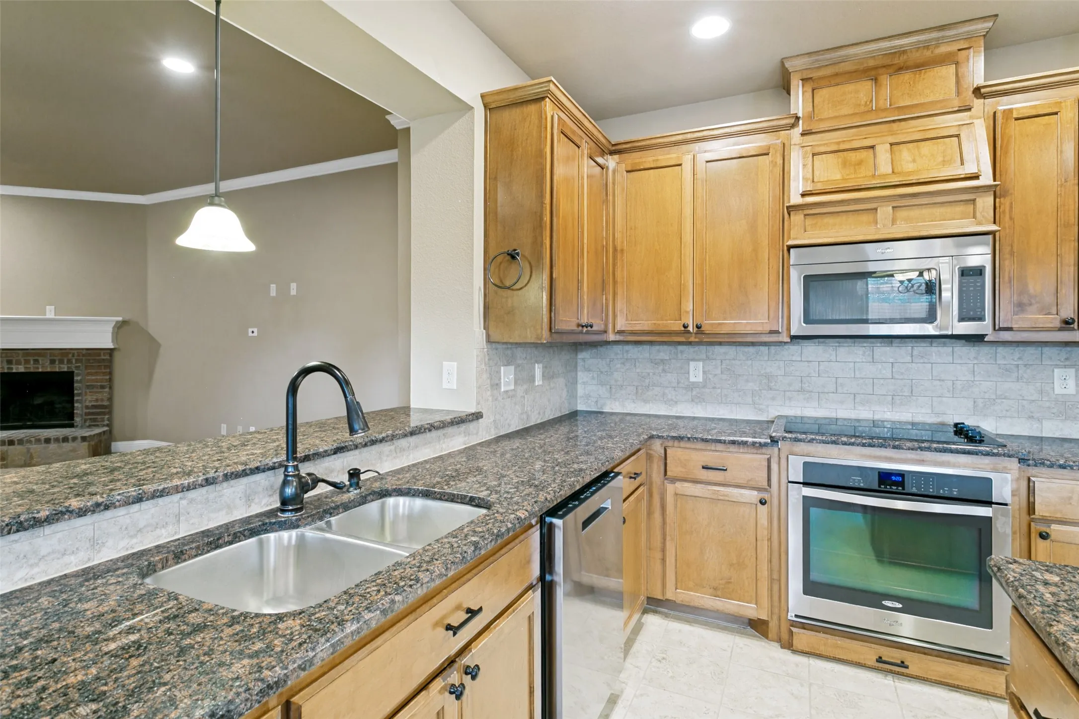 Another view of the kitchen and looking into the living room