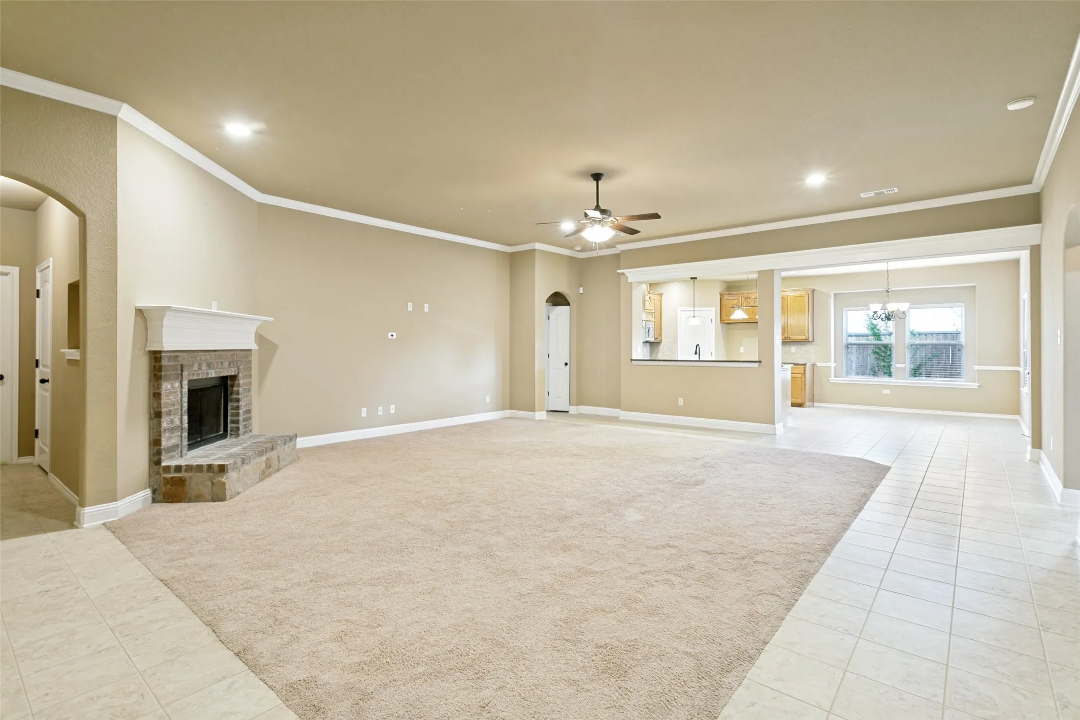 View of the living room from the added door in the living room and also view of the kitchen.